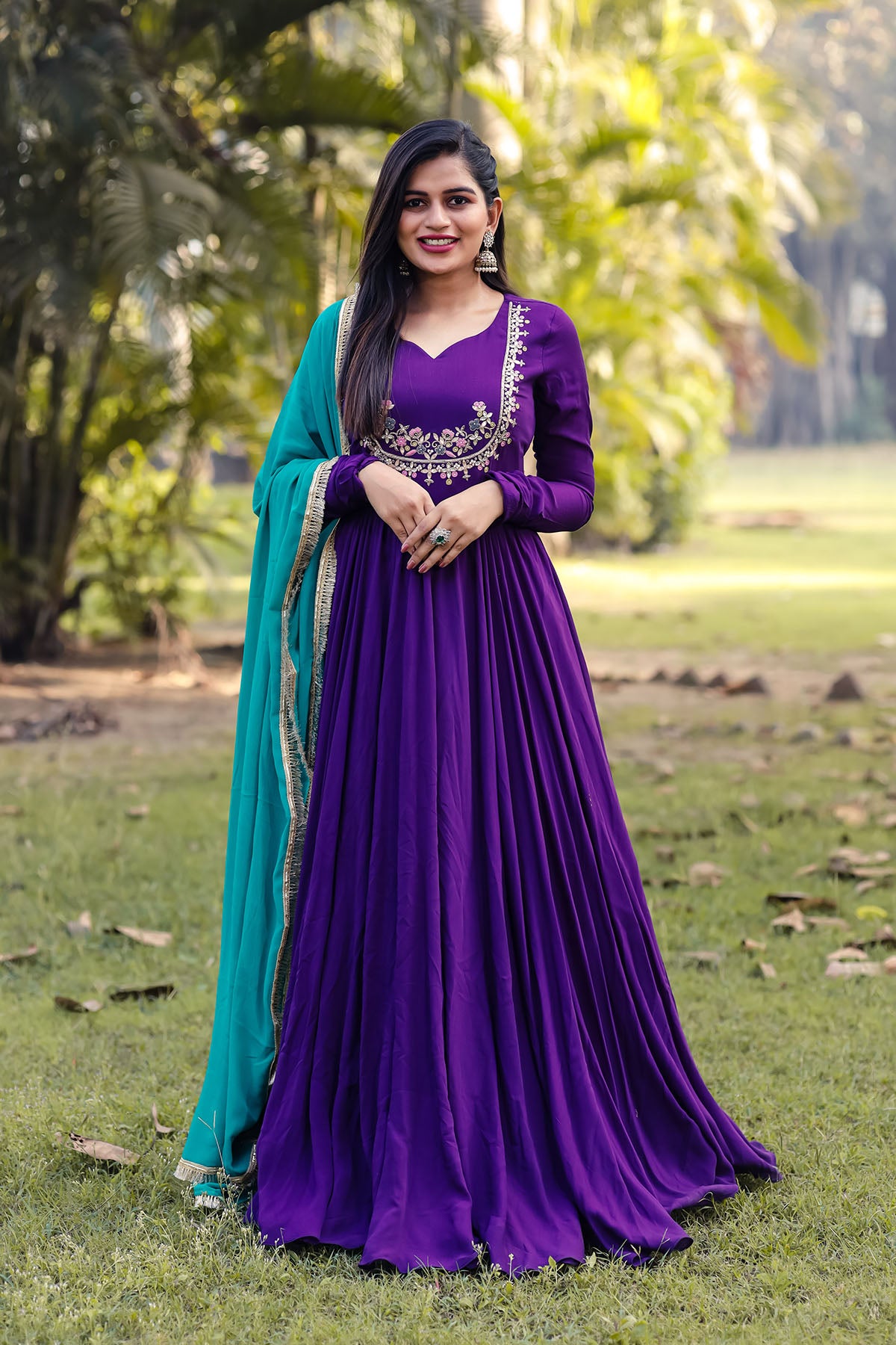 a woman in a purple and blue gown