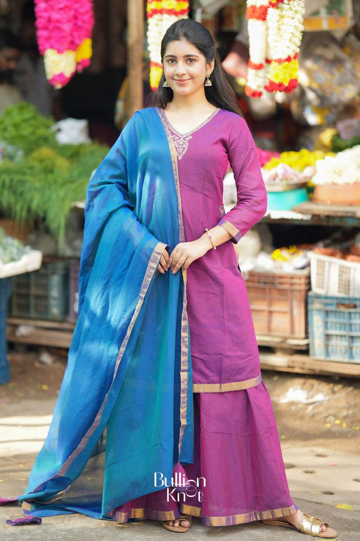Woman in purple kurta with blue dupatta, traditional and ceremonial clothing