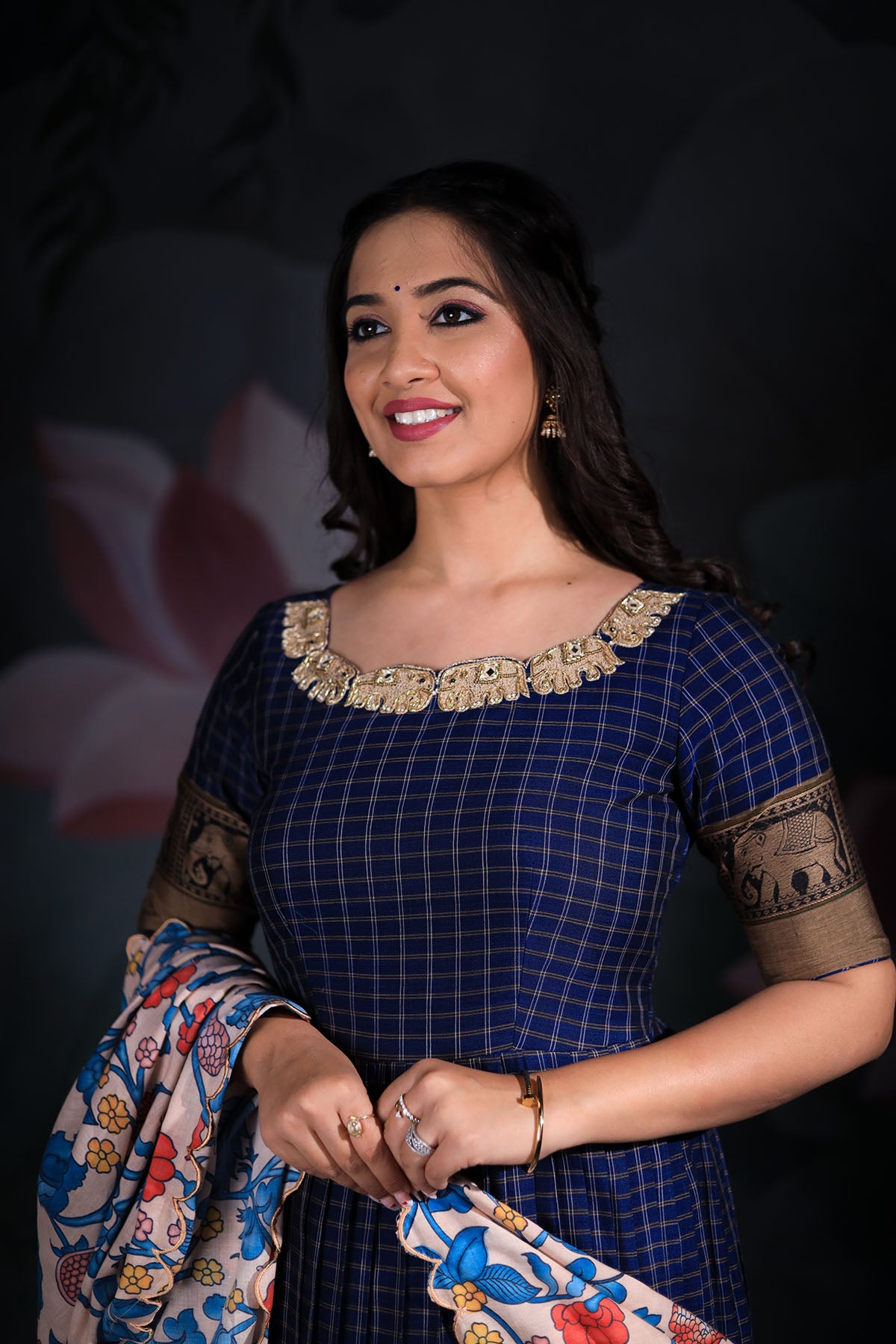 a woman in navy blue Anarkali dress