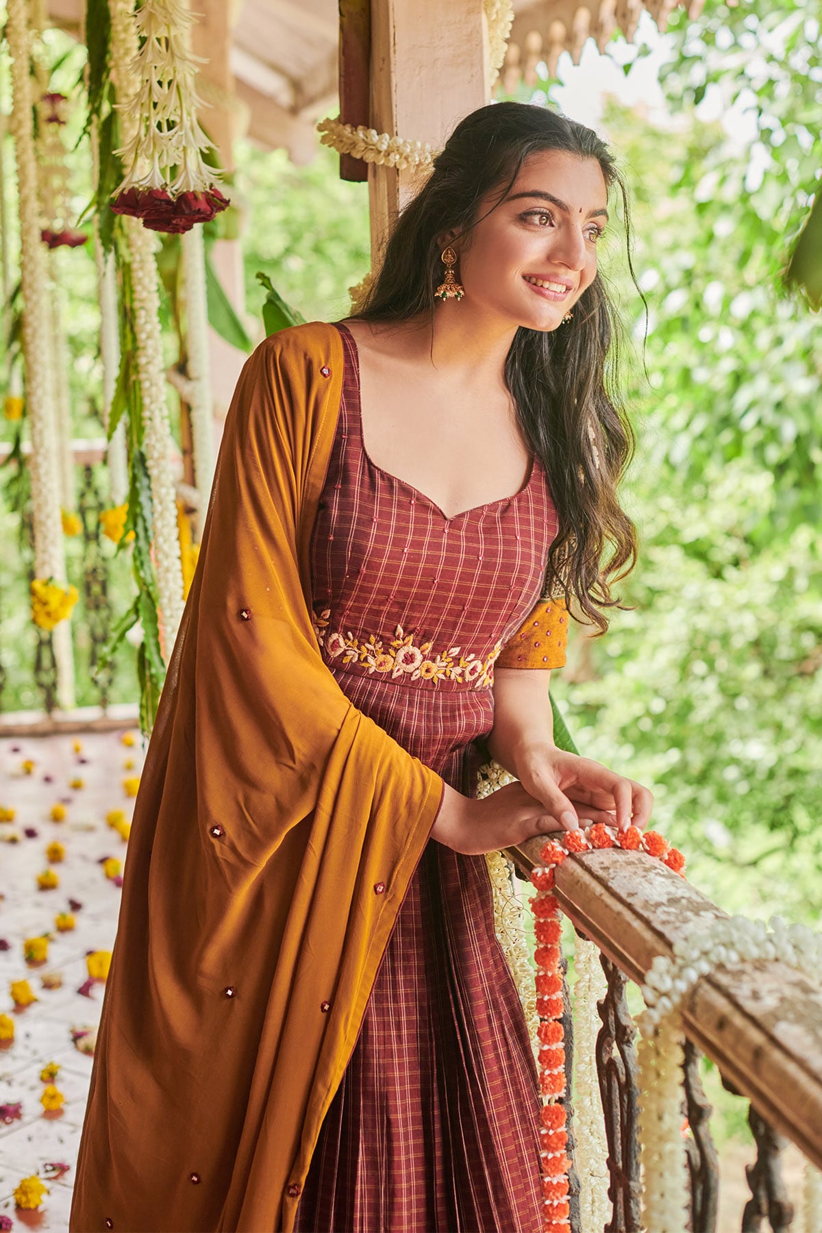 a woman in maroon dress
