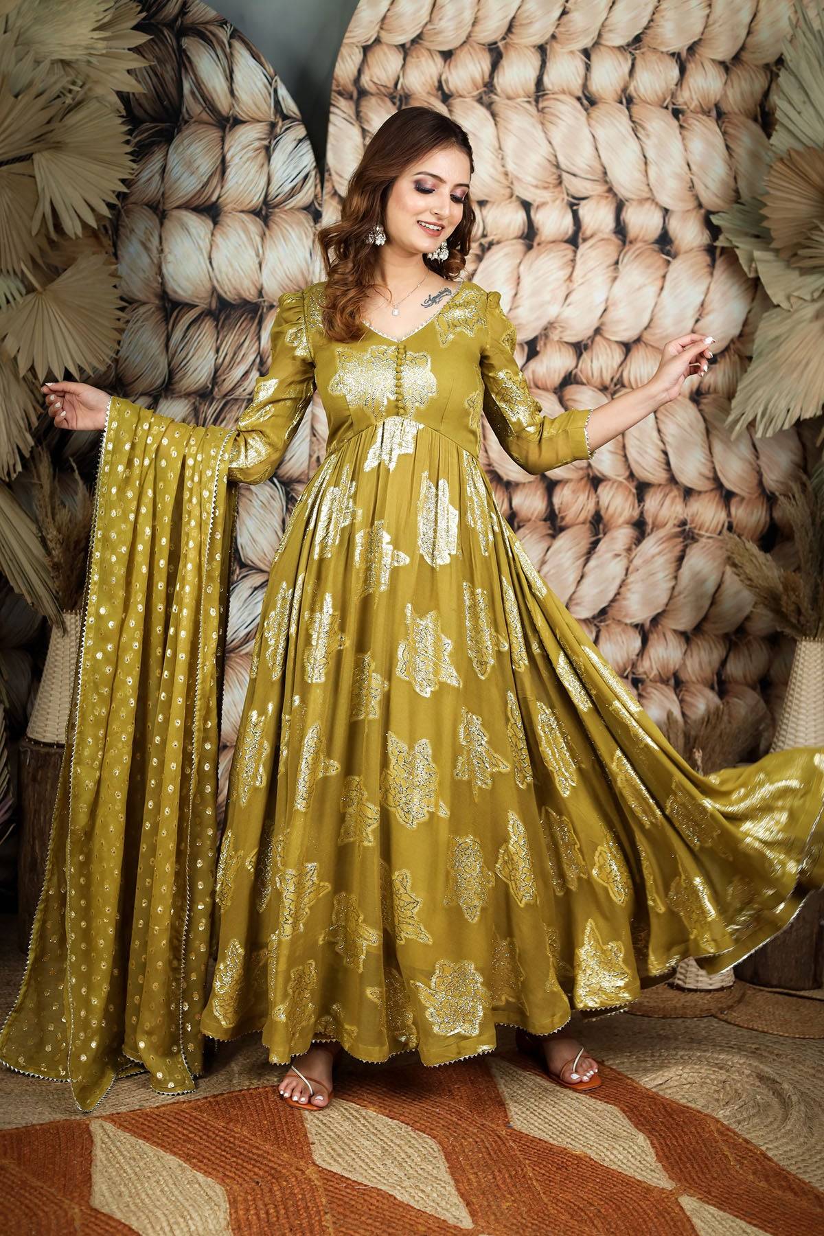 a woman in green anarkali dress