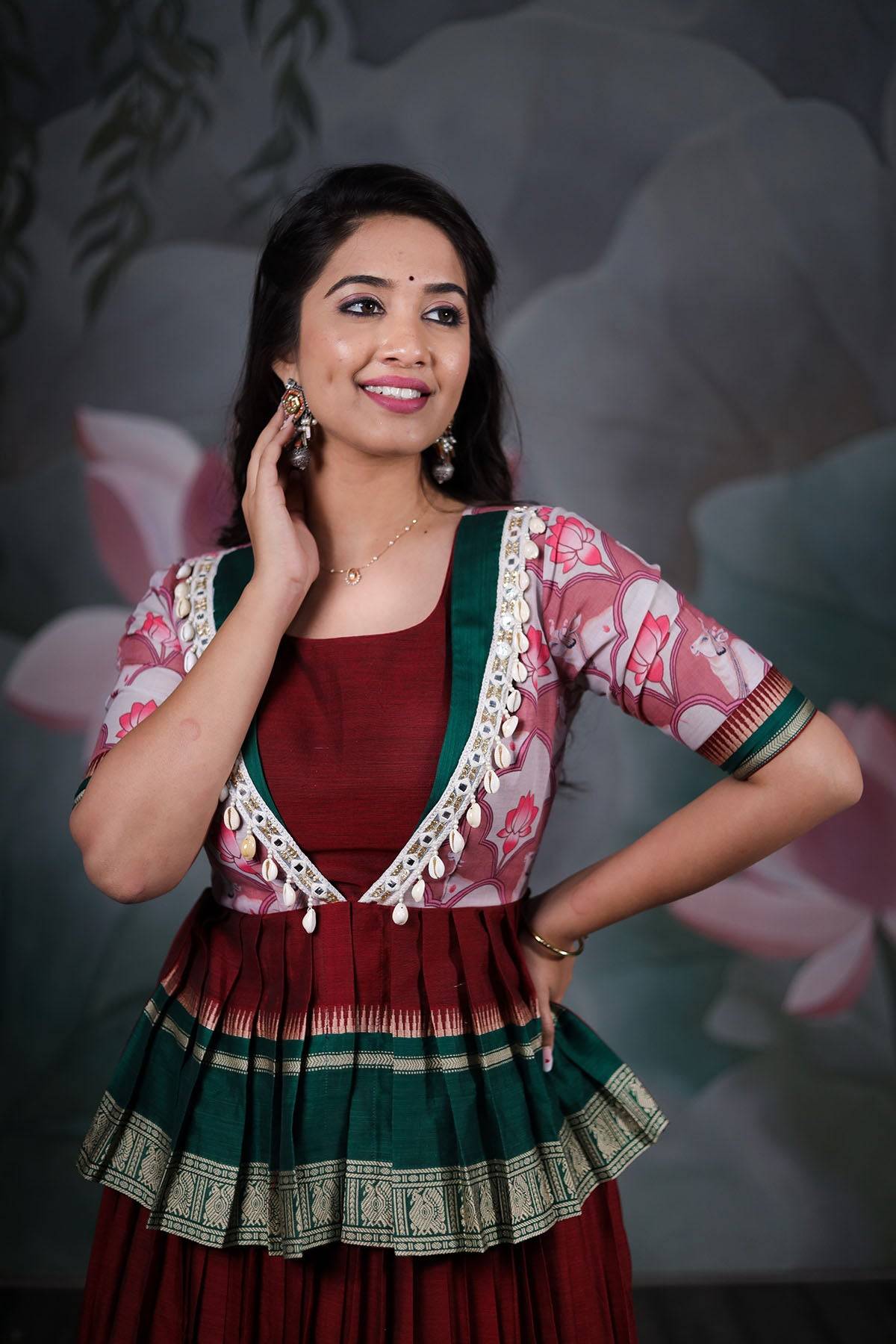 a woman in maroon handloom lahenga set