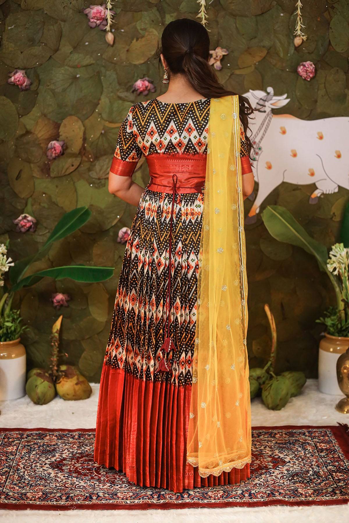 a woman in pattu half saree
