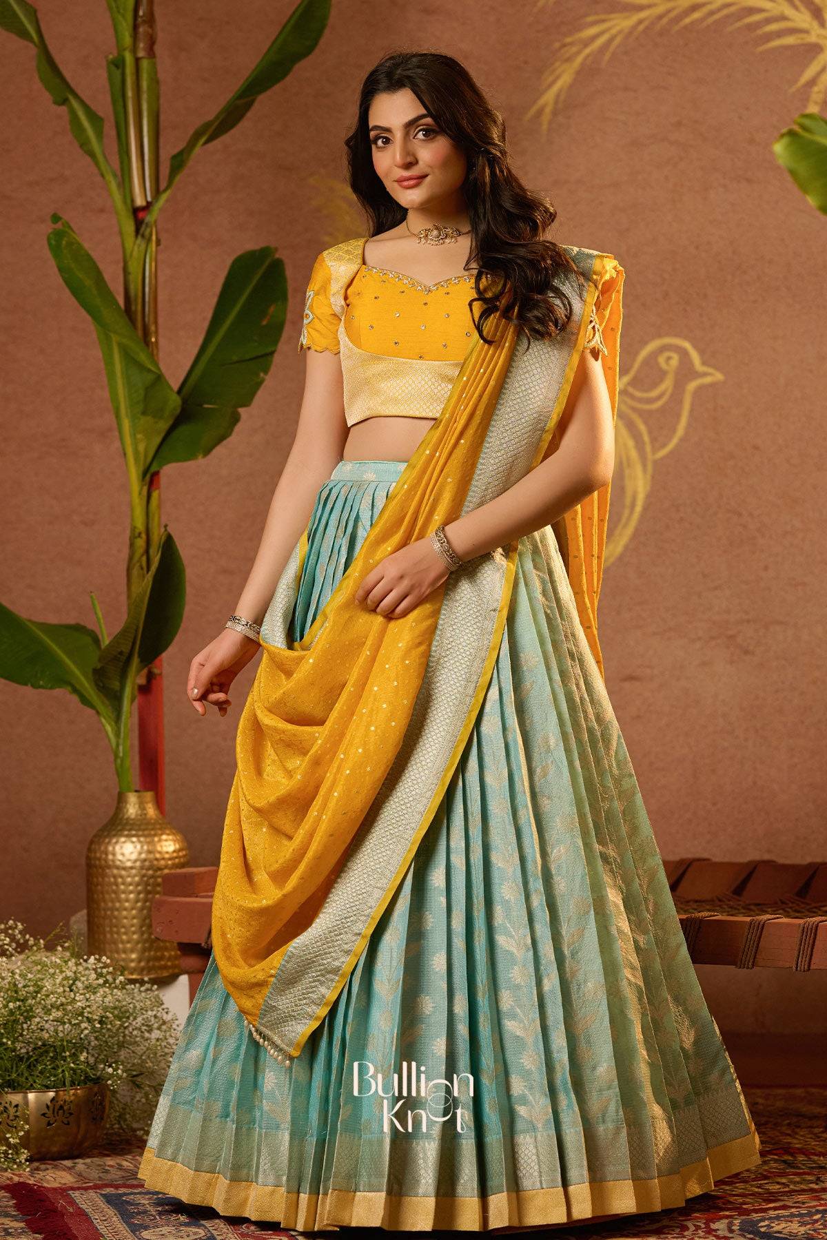 Woman wearing a yellow and green traditional outfit