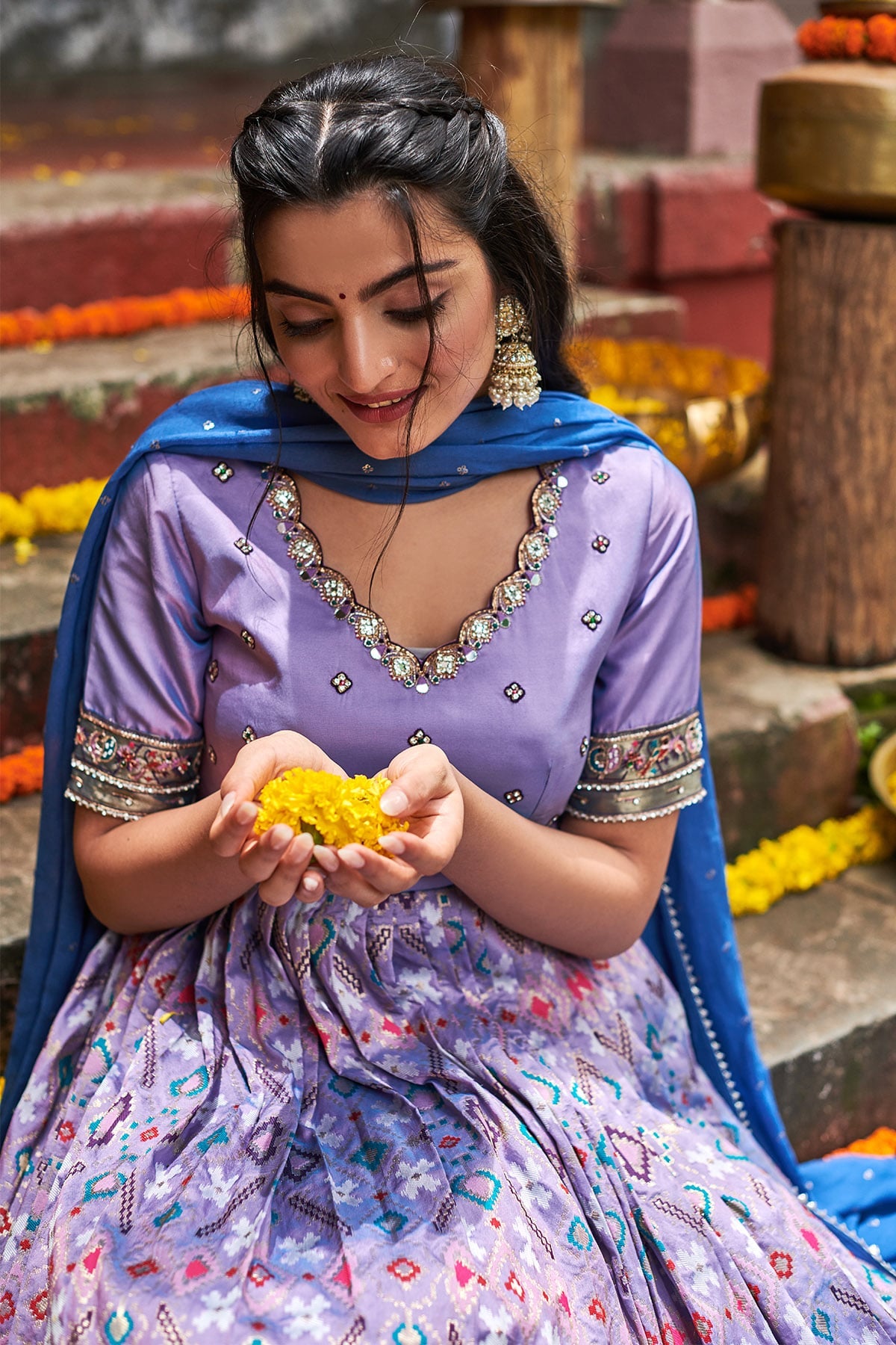 a woman in Lilac patola dress