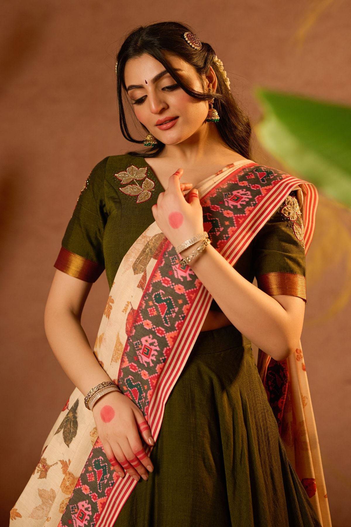 Tithi Lehenga Set in Mehendi at bullionknot showcasing intricate embroidery on blouse and printed dupatta. Elegant choice in traditional ceremonial clothing.
