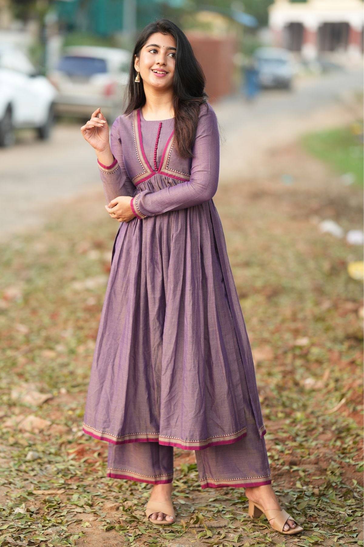 Exclusive Kurta & Suit Set - Lipika Kurta Set in greyish lavender with flared silhouette and pink embroidered detailing, ideal for festive wear.