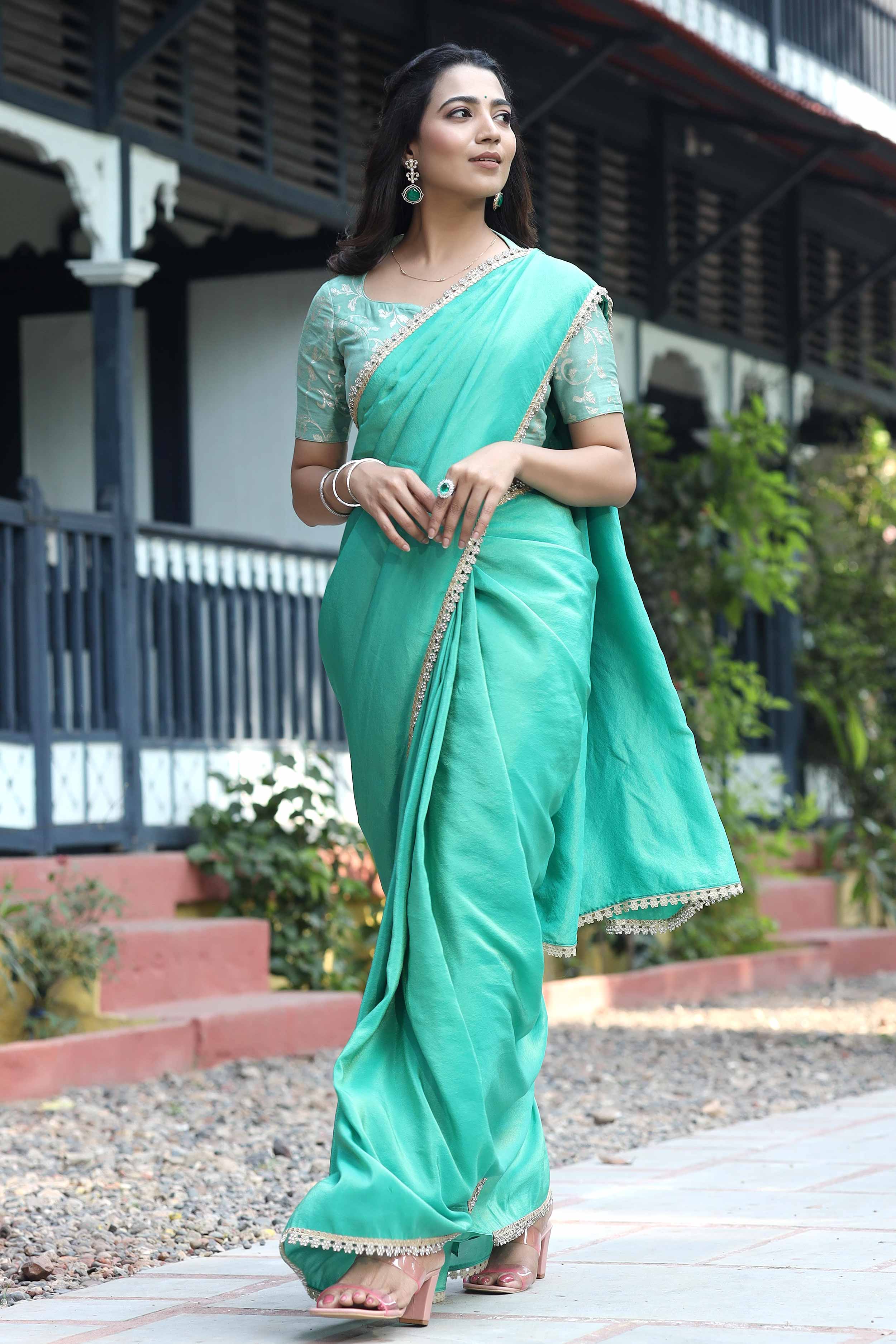a woman in green saree