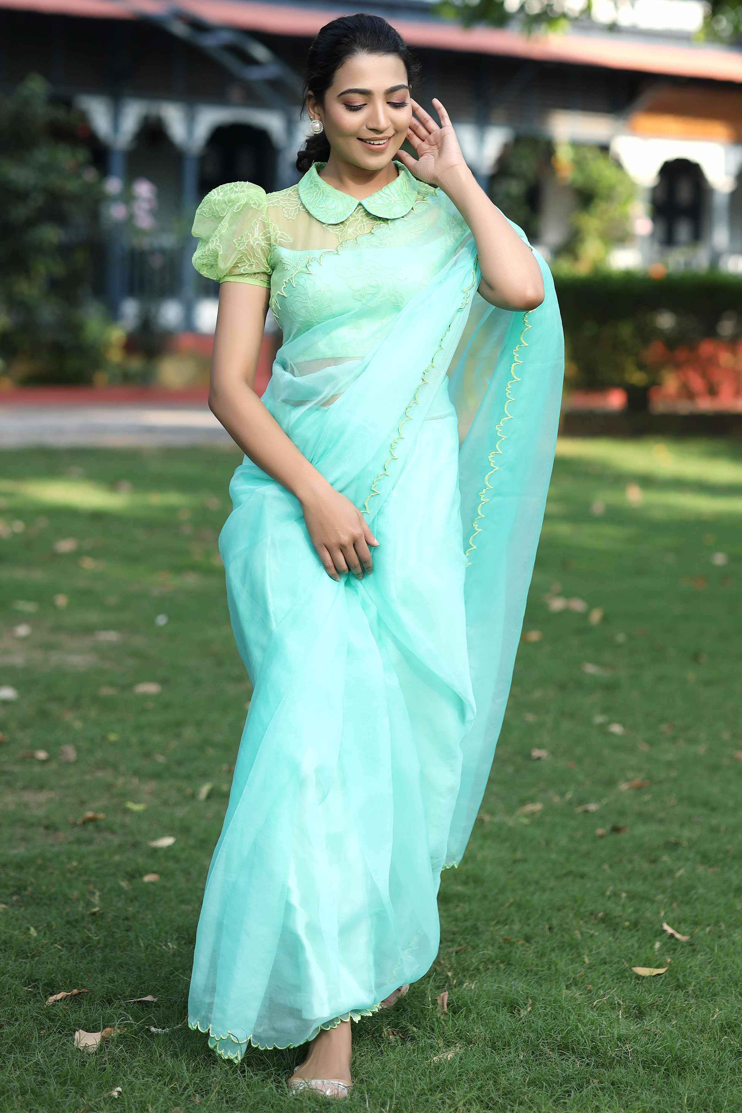 a woman in sky blue organza saree