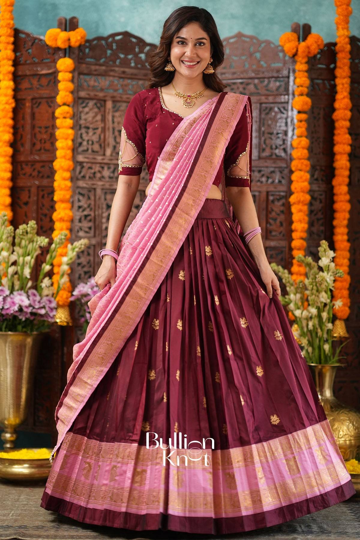 Kanakvalli Banarasi Tissue Kalamkari Lehenga Set with maroon and pink colors, traditional embroidery, and ornate border for festive occasions