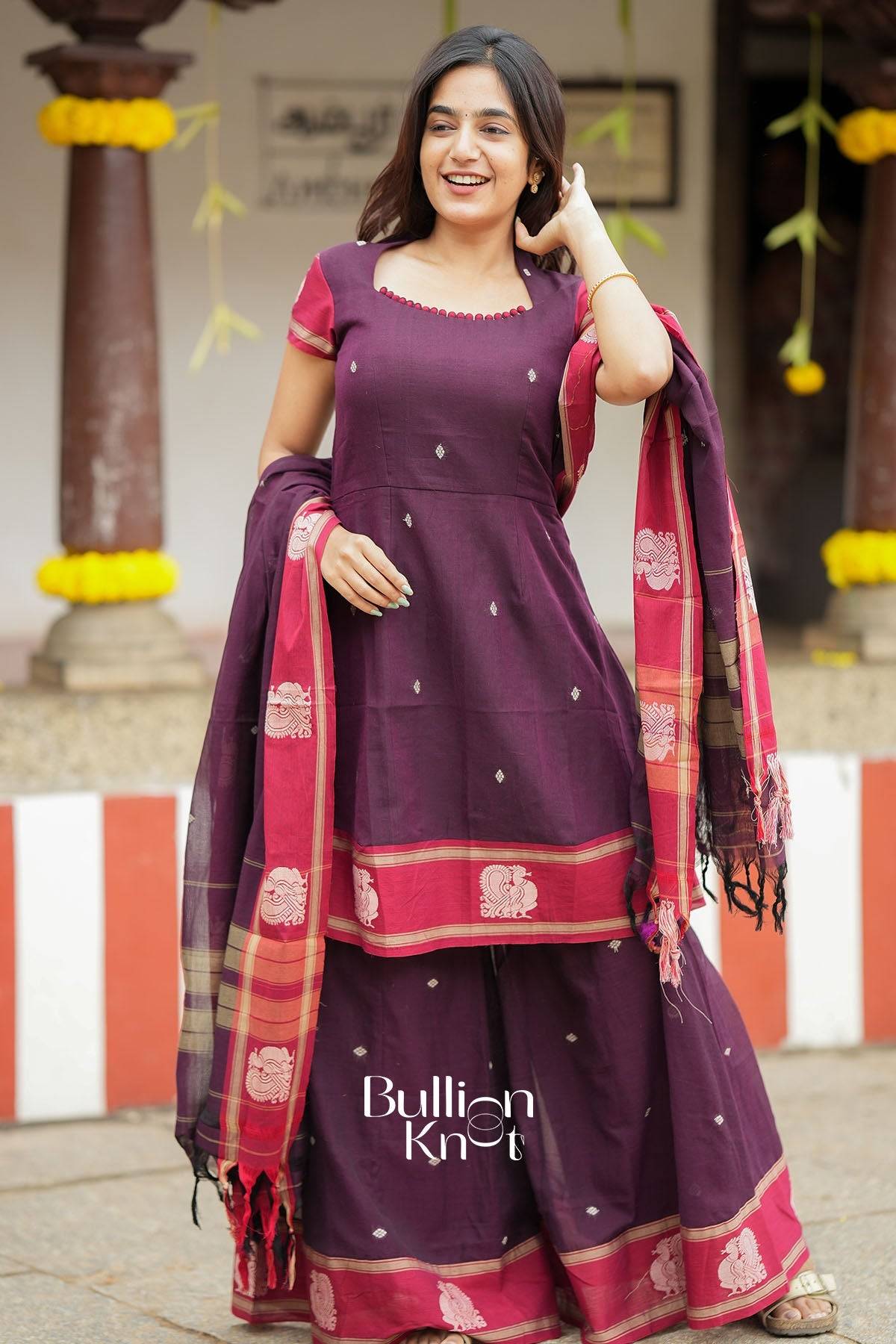 Elegant maroon traditional dress with dupatta and gold jewelry