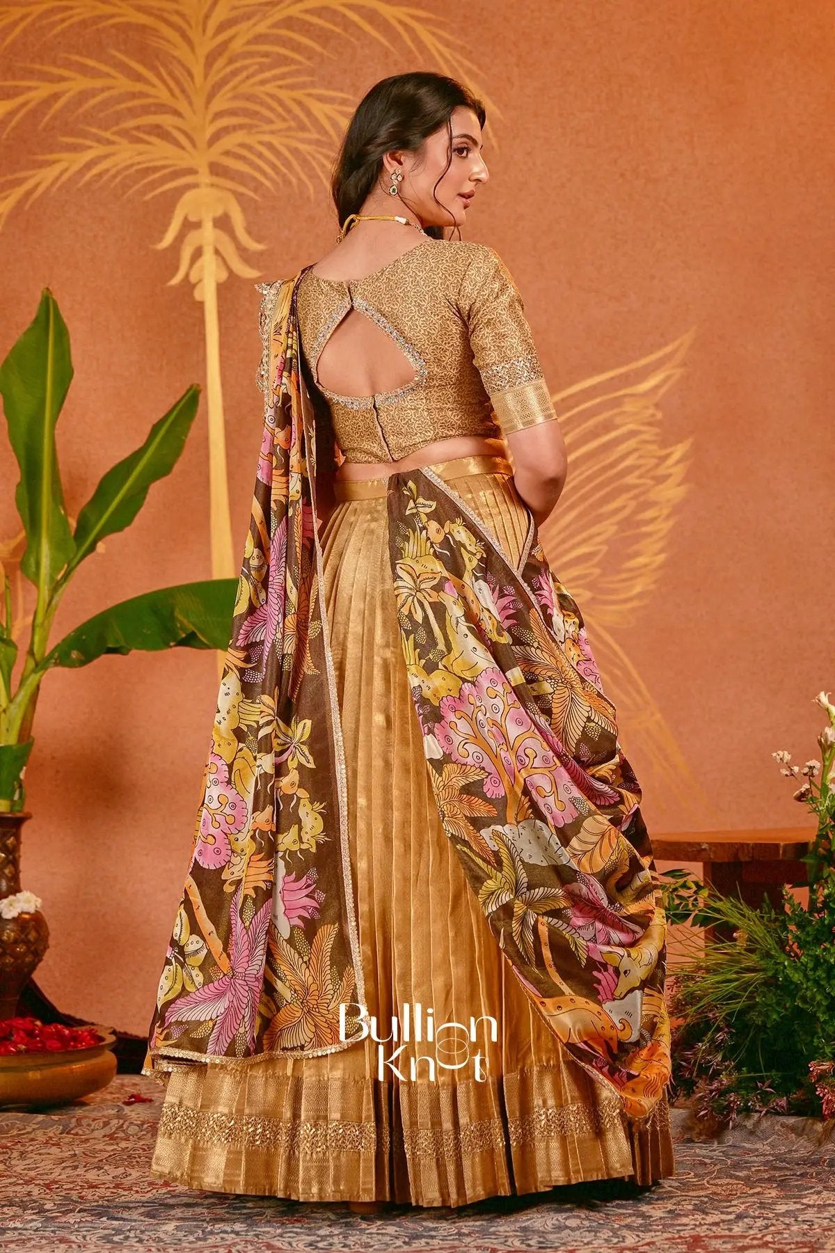 Golden tissue silk lehenga set with Kalamkari dupatta for traditional wear