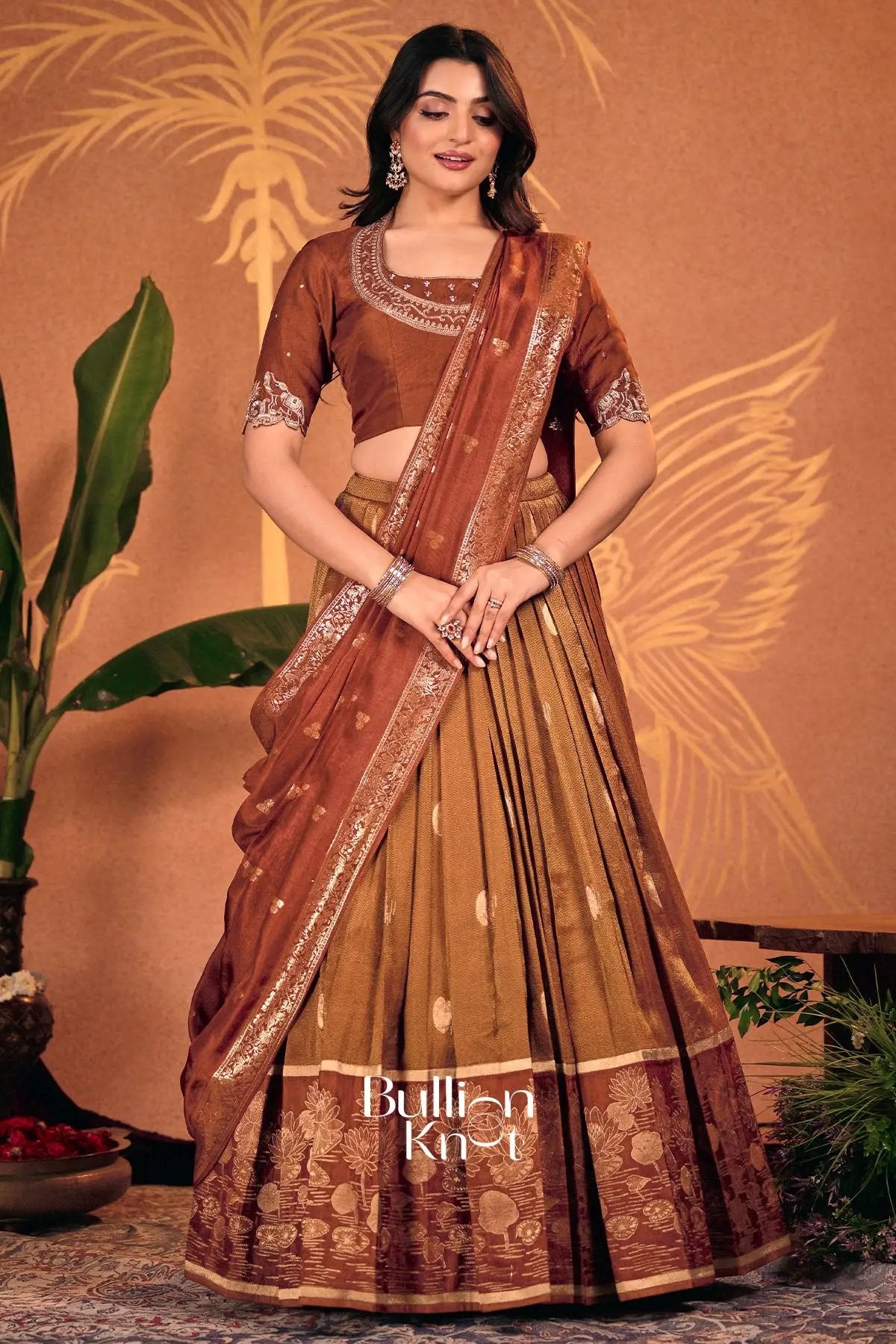 Model wearing Pavitra Copper Rust Silk Lehenga Set for traditional occasions