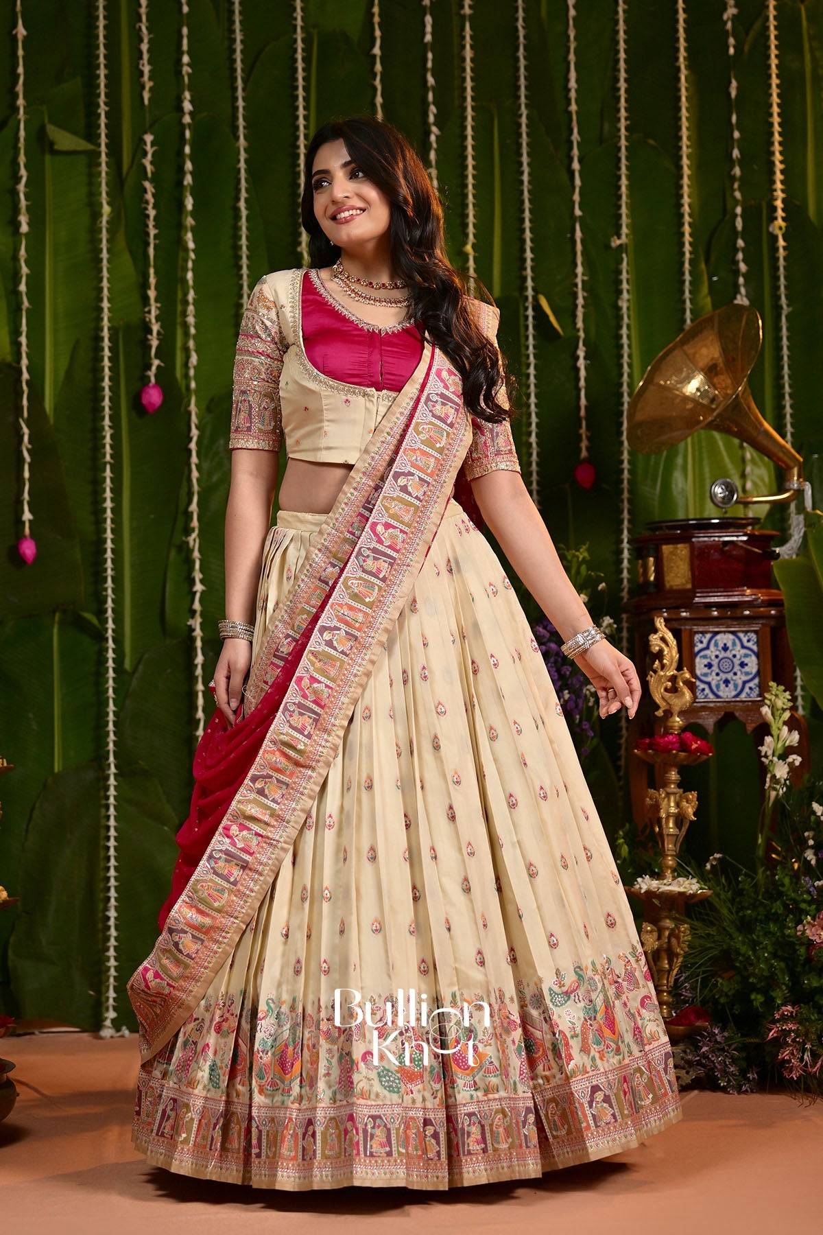 Cream and pink embroidered lehenga with detailed border for festive events