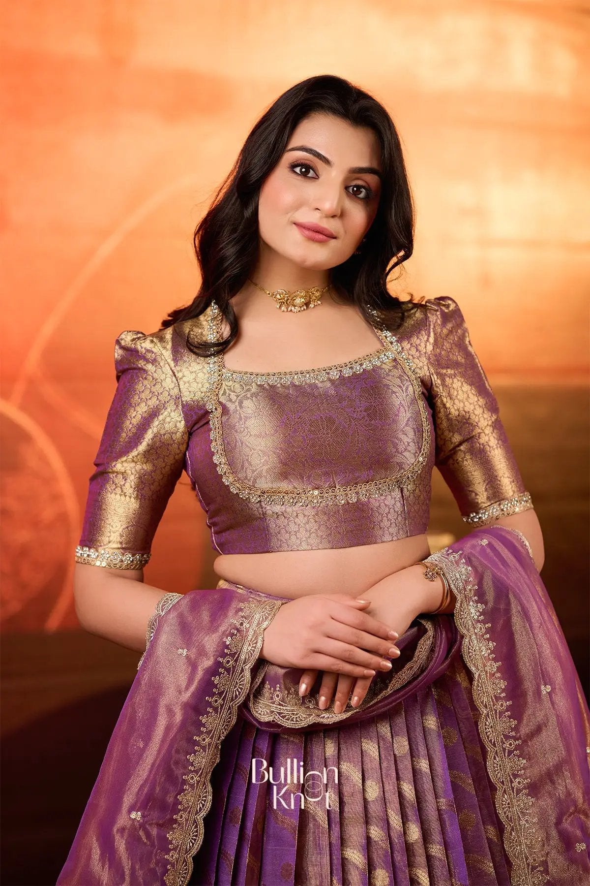 Close-up of Urja Tissue Zari Lehenga Set in Purple with intricate gold zari blouse and dupatta, perfect for ceremonial wear at bullionknot.