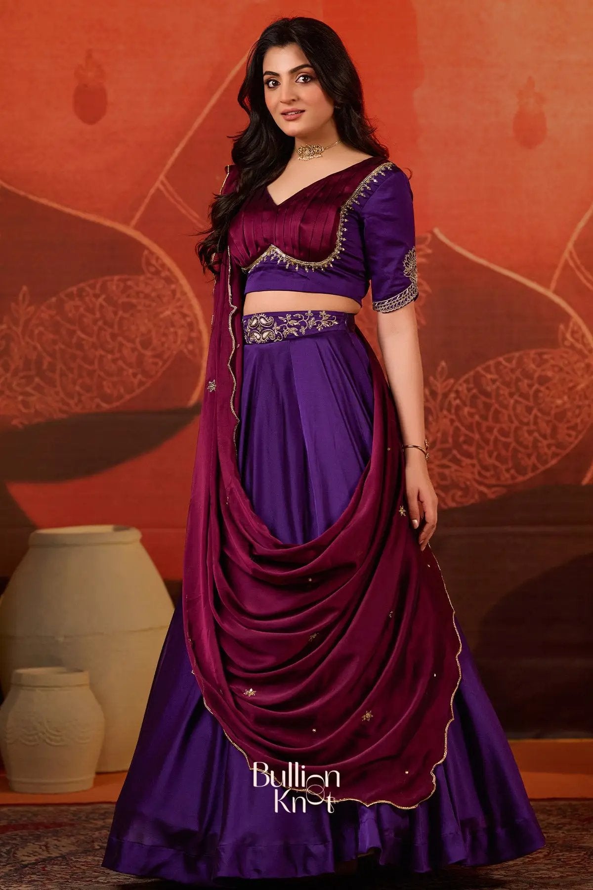 Elegant Ariana Charm Lehenga Set in Purple at bullionknot, featuring a stylish maroon dupatta draped over a luxurious purple lehenga.