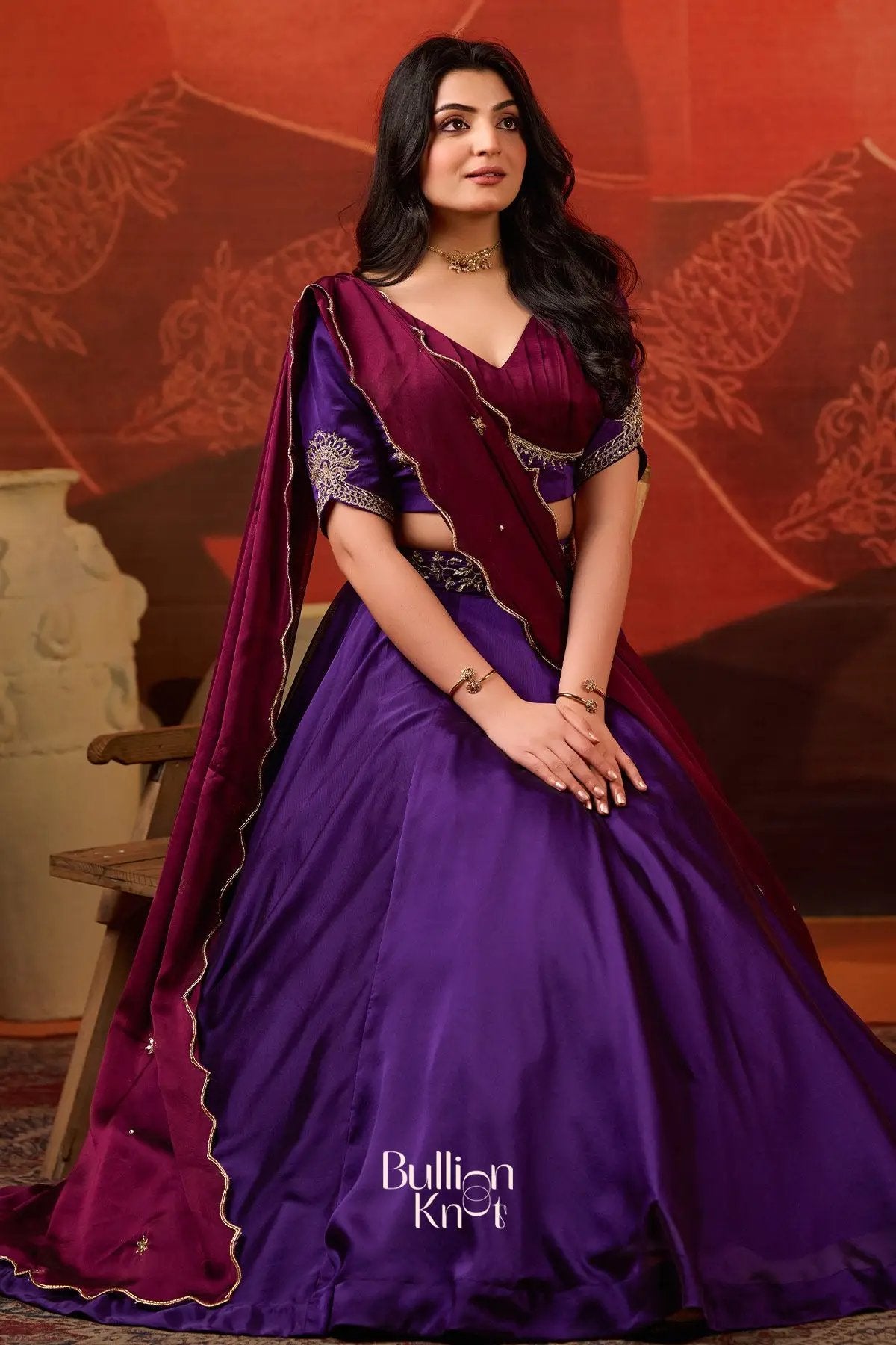 Graceful Ariana Charm Lehenga Set in Purple at bullionknot, featuring a flared skirt and ornate blouse ideal for festive and ceremonial occasions.