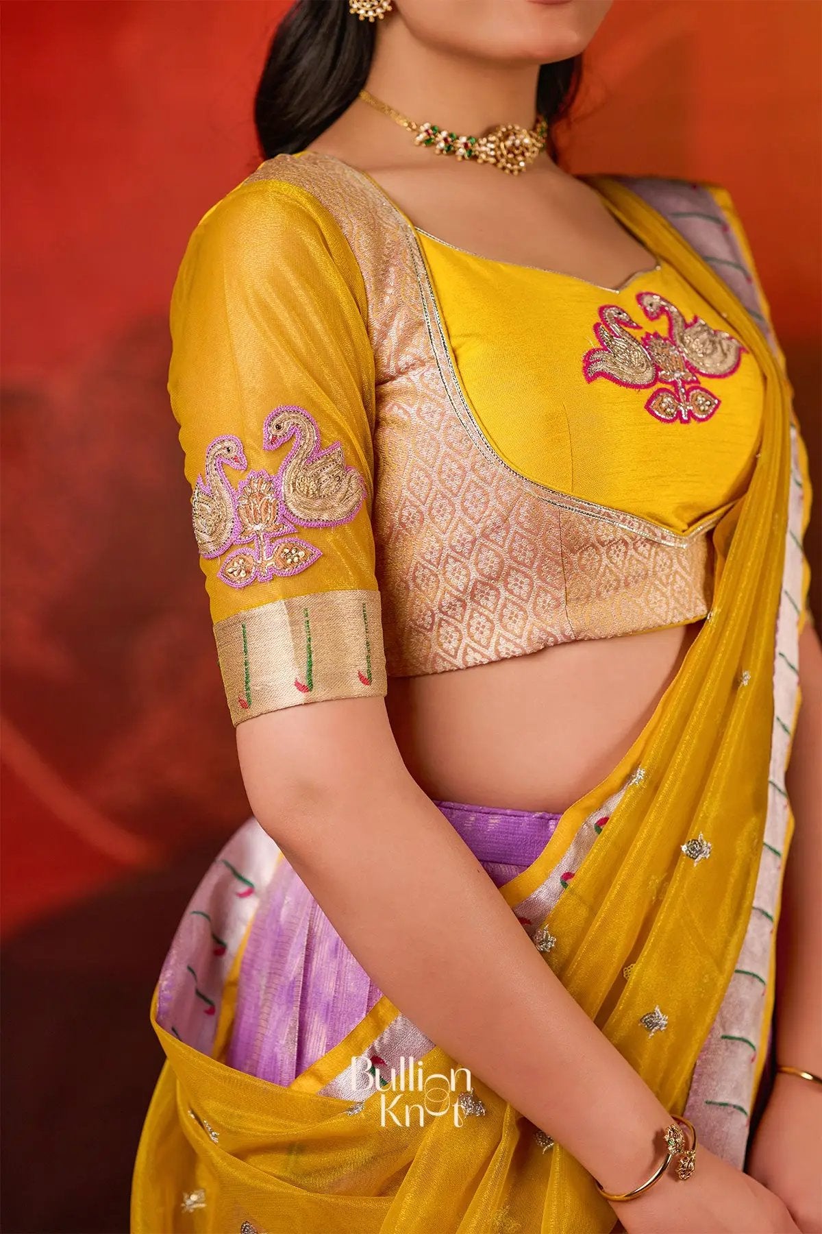 Close-up of Kumudini Kota Lehenga Set in Lavender at bullionknot showing yellow blouse with swan embroidery and intricate sleeve detailing.