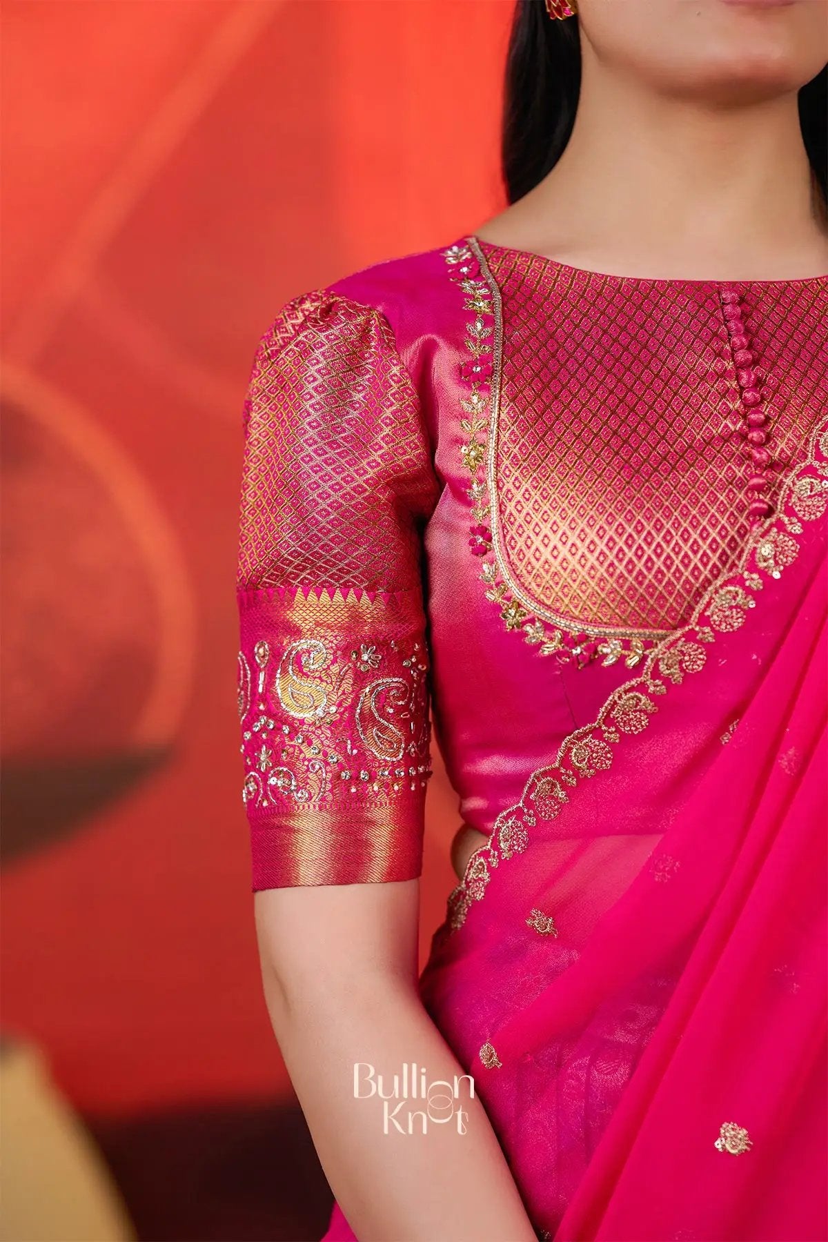 Close-up of the Pranjal Silk Lehenga Set in Pink at bullionknot showing detailed zari embroidery on the blouse sleeve and neckline.