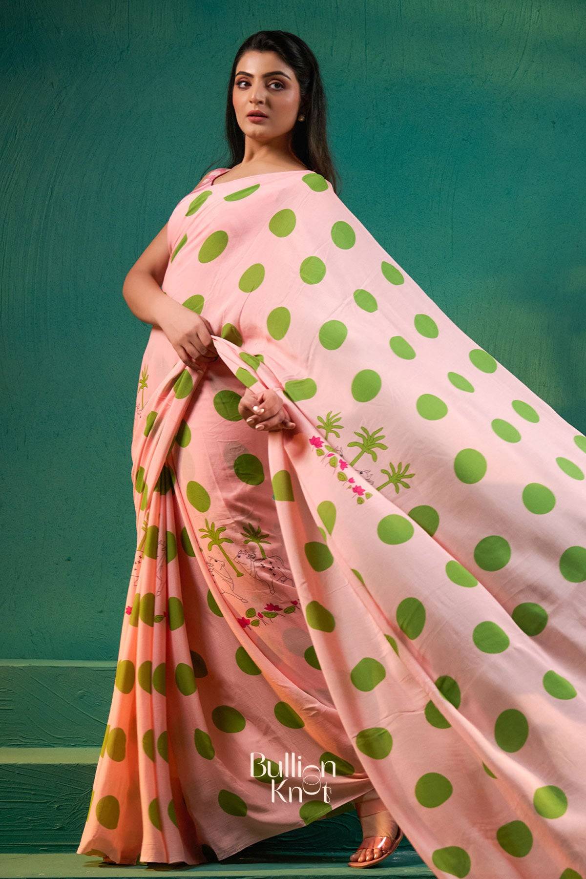 Elegant Raveena Saree in Baby Pink with green polka dots and embroidered details, available in Exclusive Sarees at bullionknot.