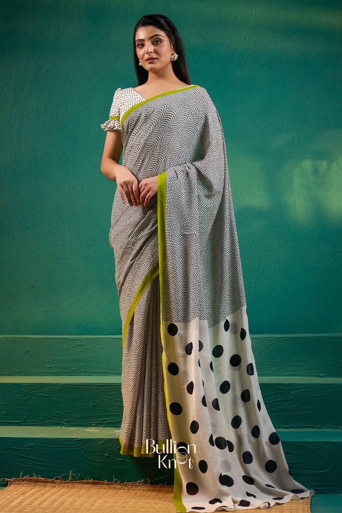 Exclusive Sarees - Karishma Saree in Black at bullionknot featuring fine black patterns with bold polka dots and lime green border in a modern drape.