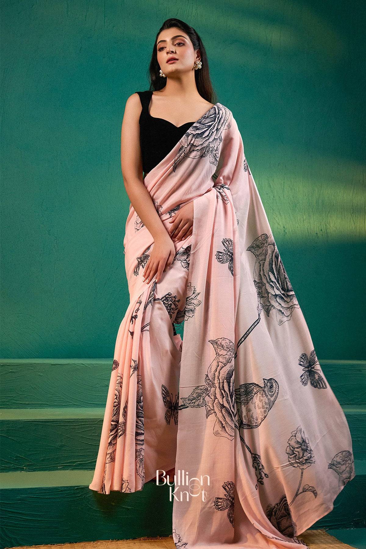 Shop Exclusive Sarees - Sreeleela Saree in Pastel Pink at bullionknot, showcasing soft drape and intricate floral detailing for ceremonial elegance.