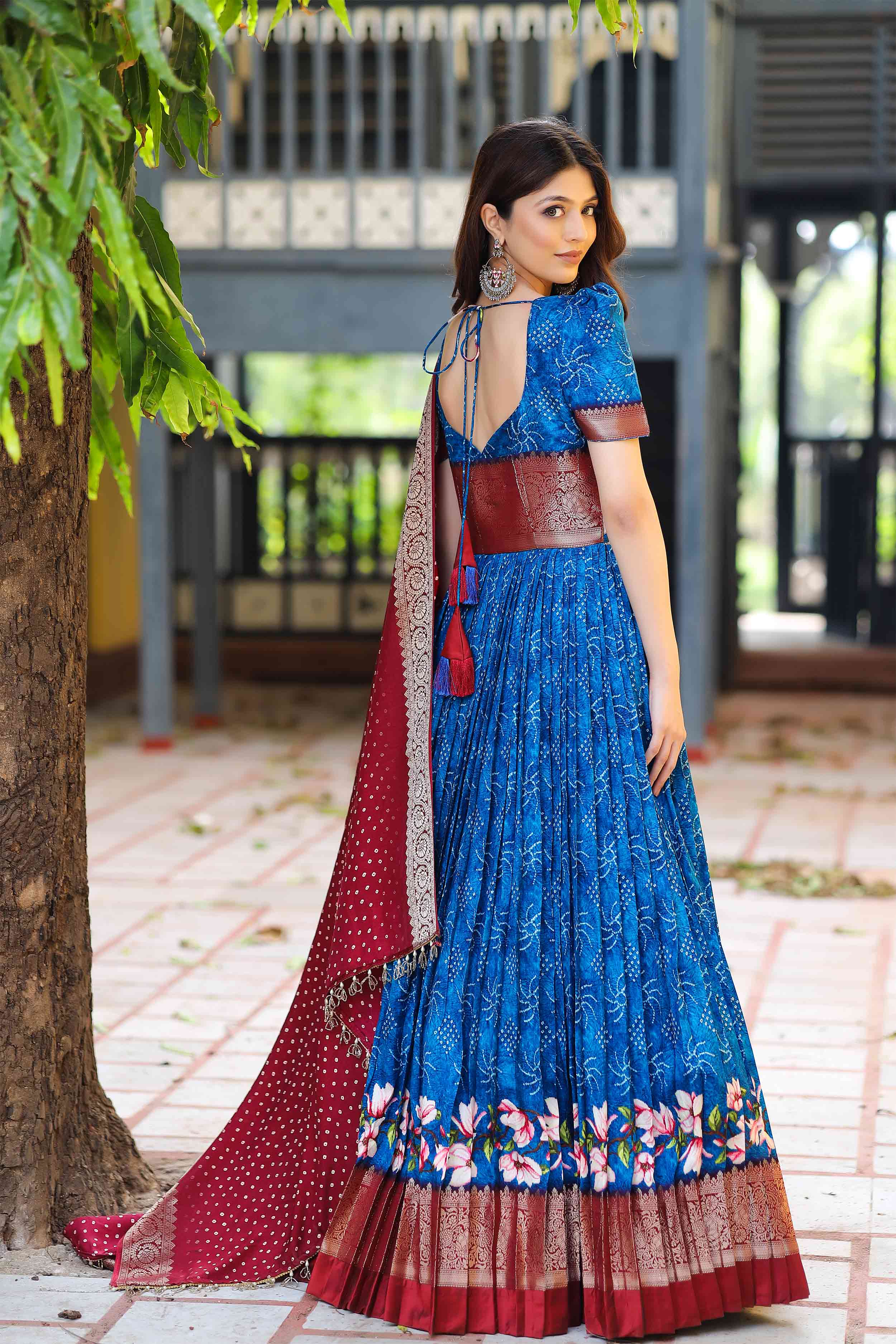 a woman in blue banarasi dress
