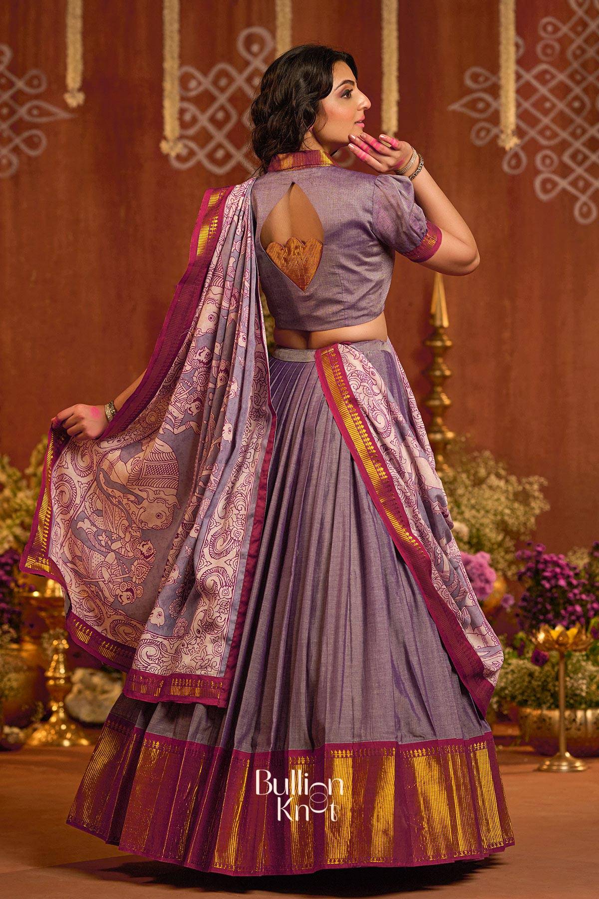 Back view of Gunika Lehenga Set in Lavender highlighting keyhole blouse design and detailed handloom dupatta with gold border.