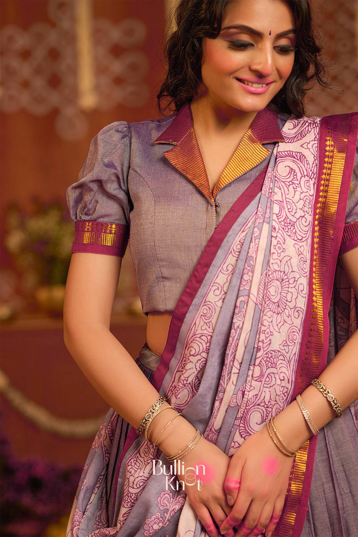 Close-up of Gunika Handloom Lehenga Set in Lavender showcasing intricate floral dupatta design and puff-sleeve blouse with gold accents.