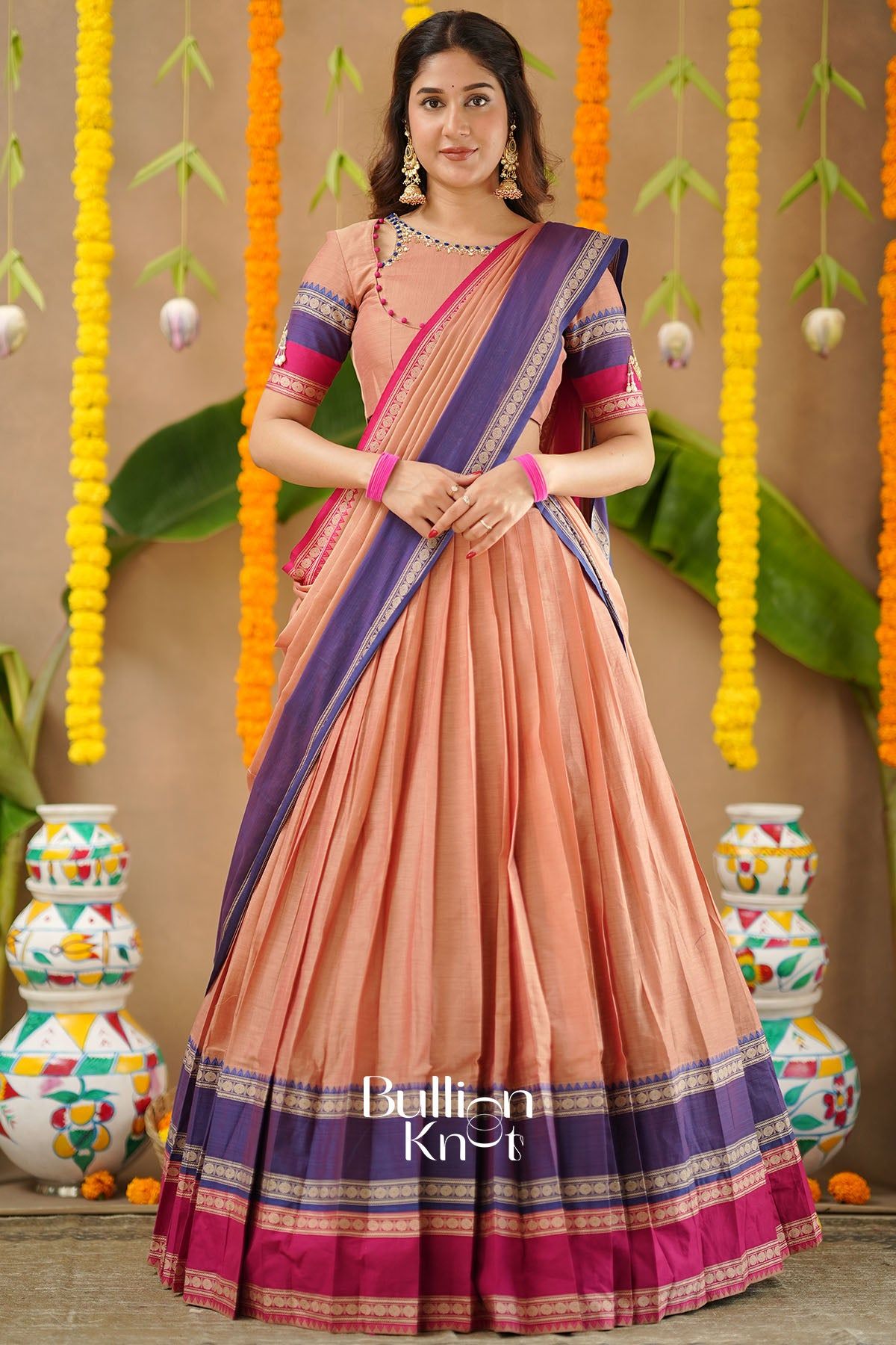 Navy blue and peach half saree with hand embroidery and cutout blouse