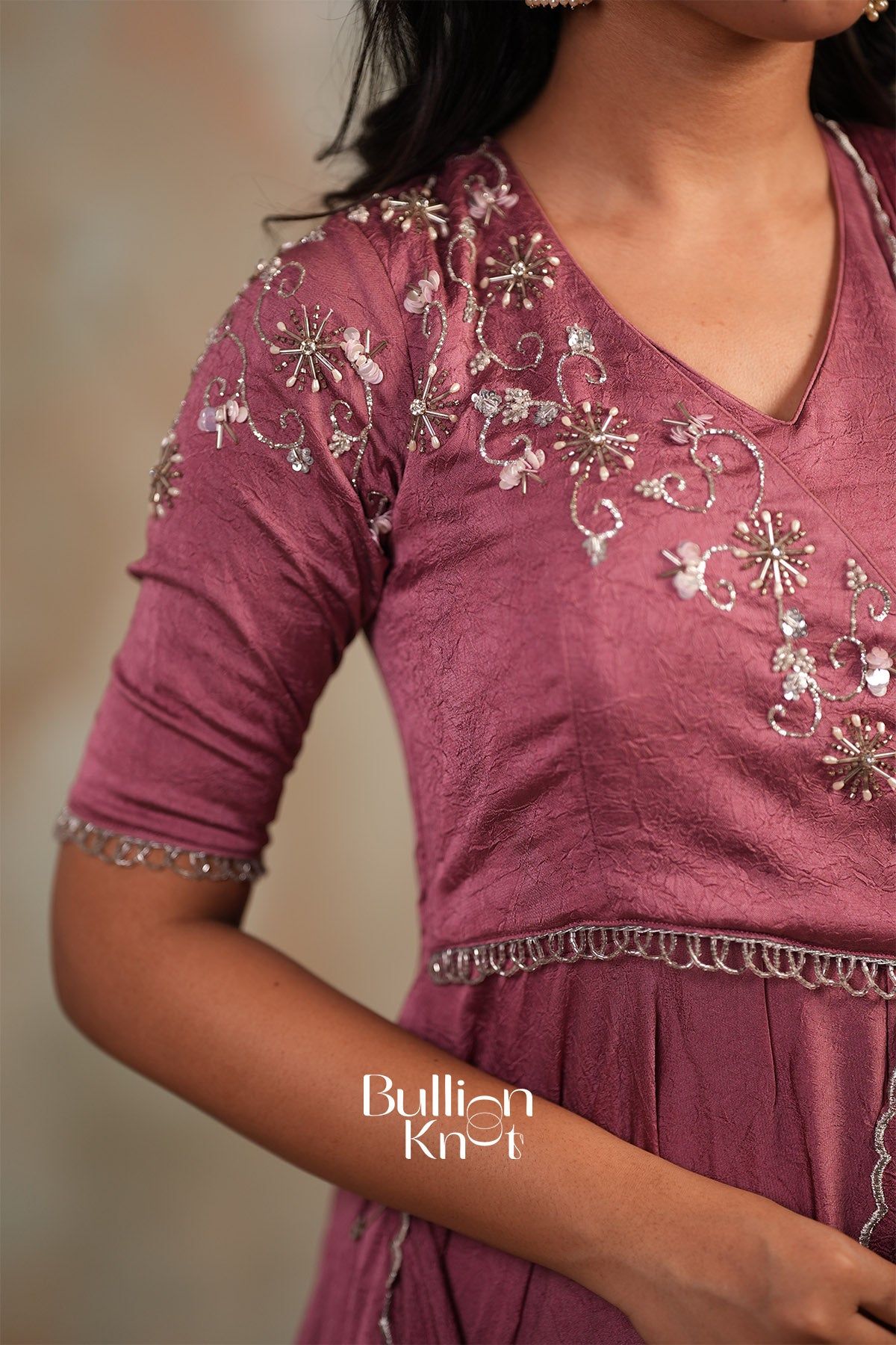 Back view of pink silk gown with lace-up back design