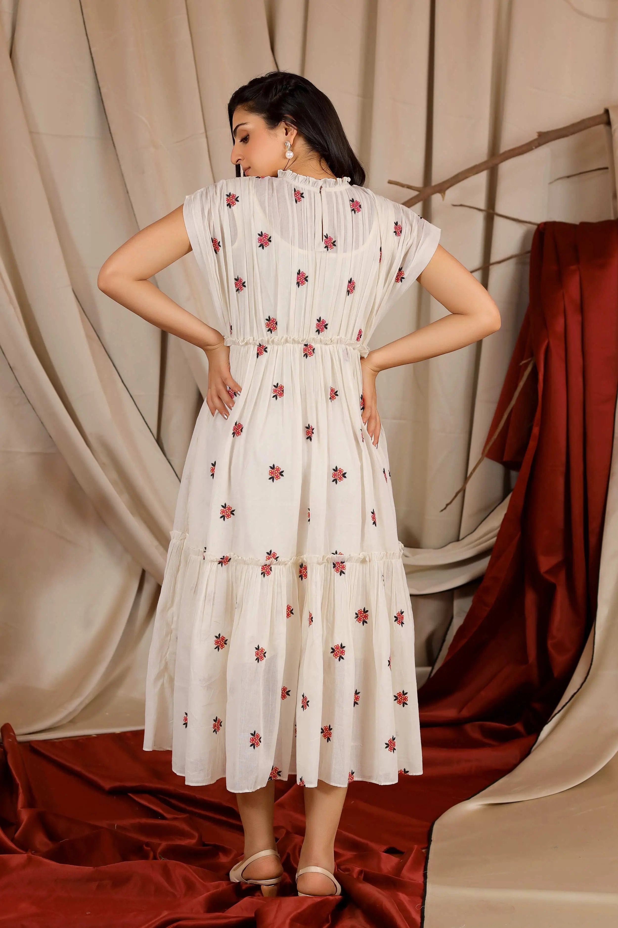 a woman in ivory midi dress