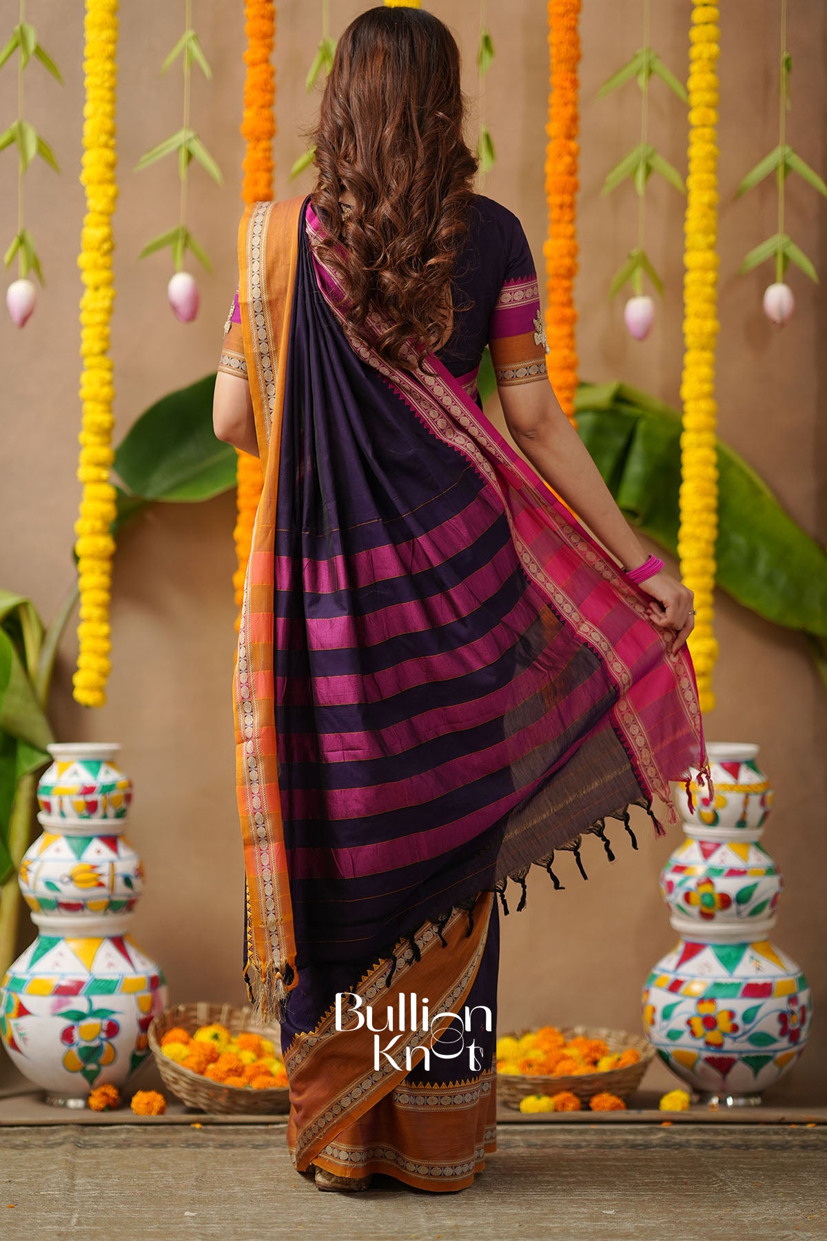 Woman in a colorful saree with handwork blouse