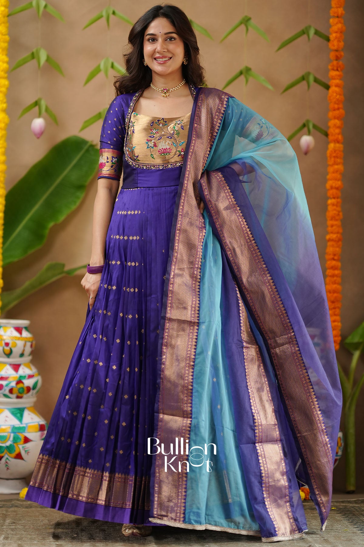 Kanika Soft Silk Blue Anarkali Gown with delicate handwork detailing – BullionKnot.”
