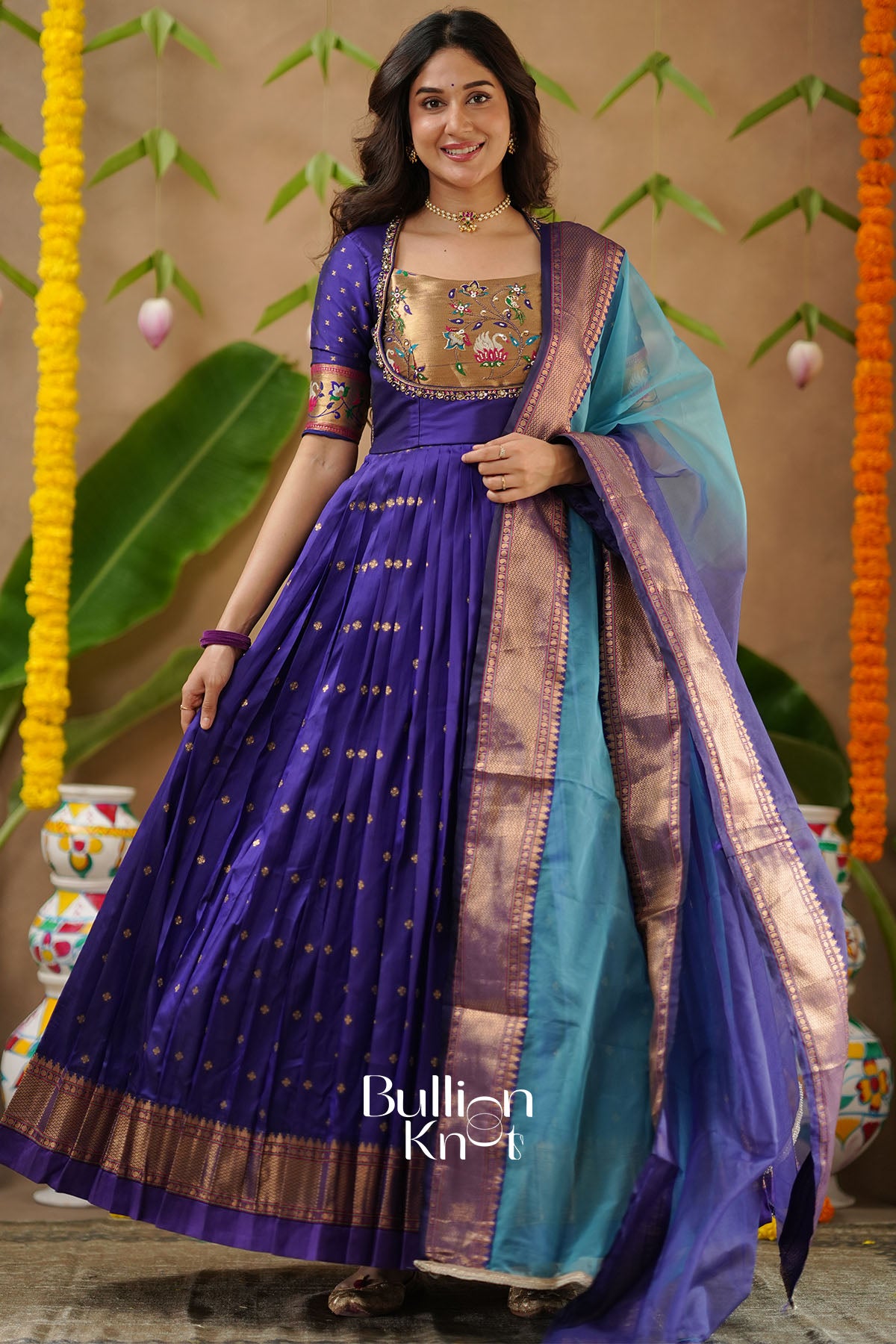 Kanika Soft Silk Blue Anarkali Gown with delicate handwork detailing – BullionKnot.”