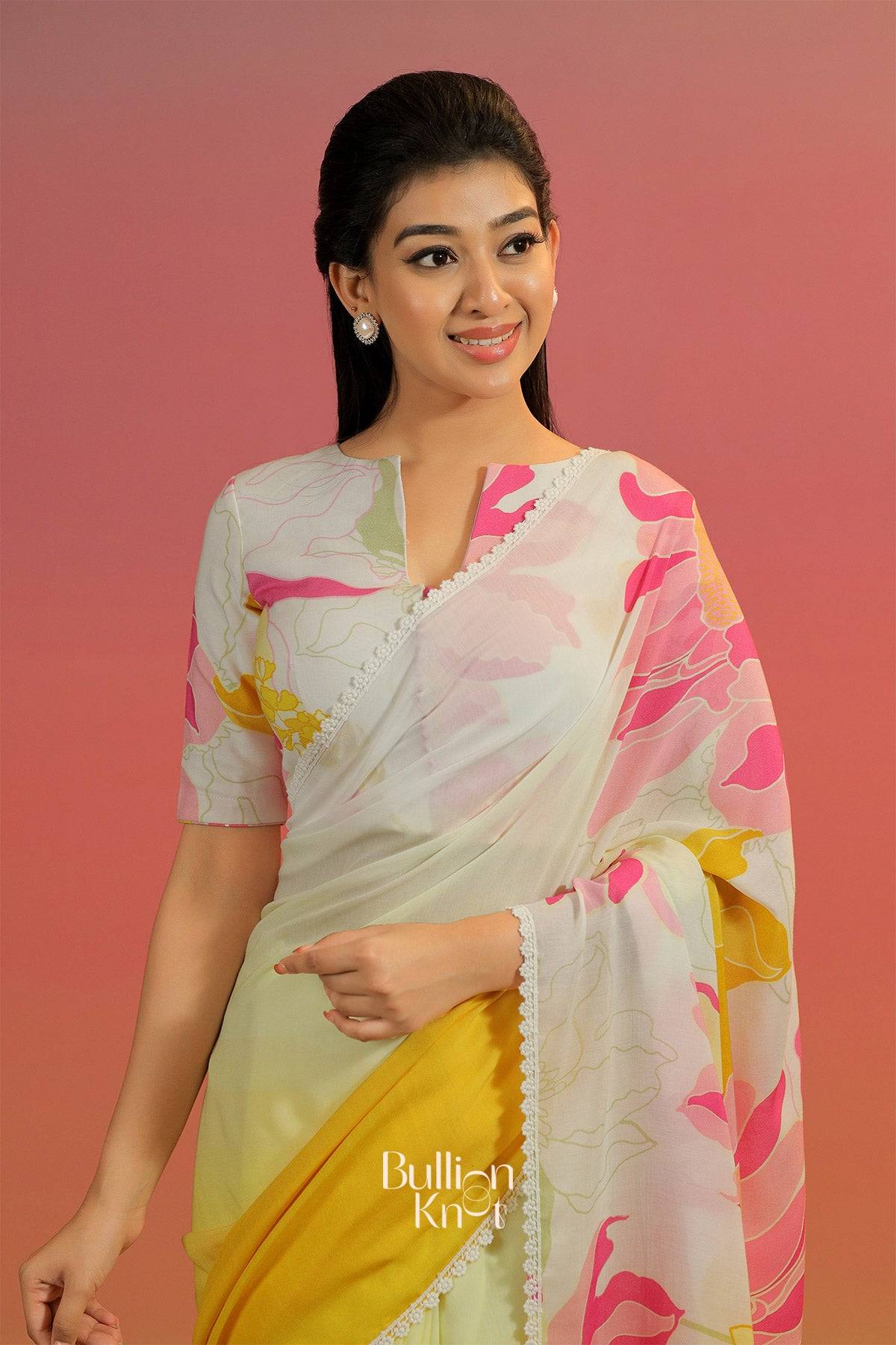 Woman wearing a floral saree with a Desigener Blouse