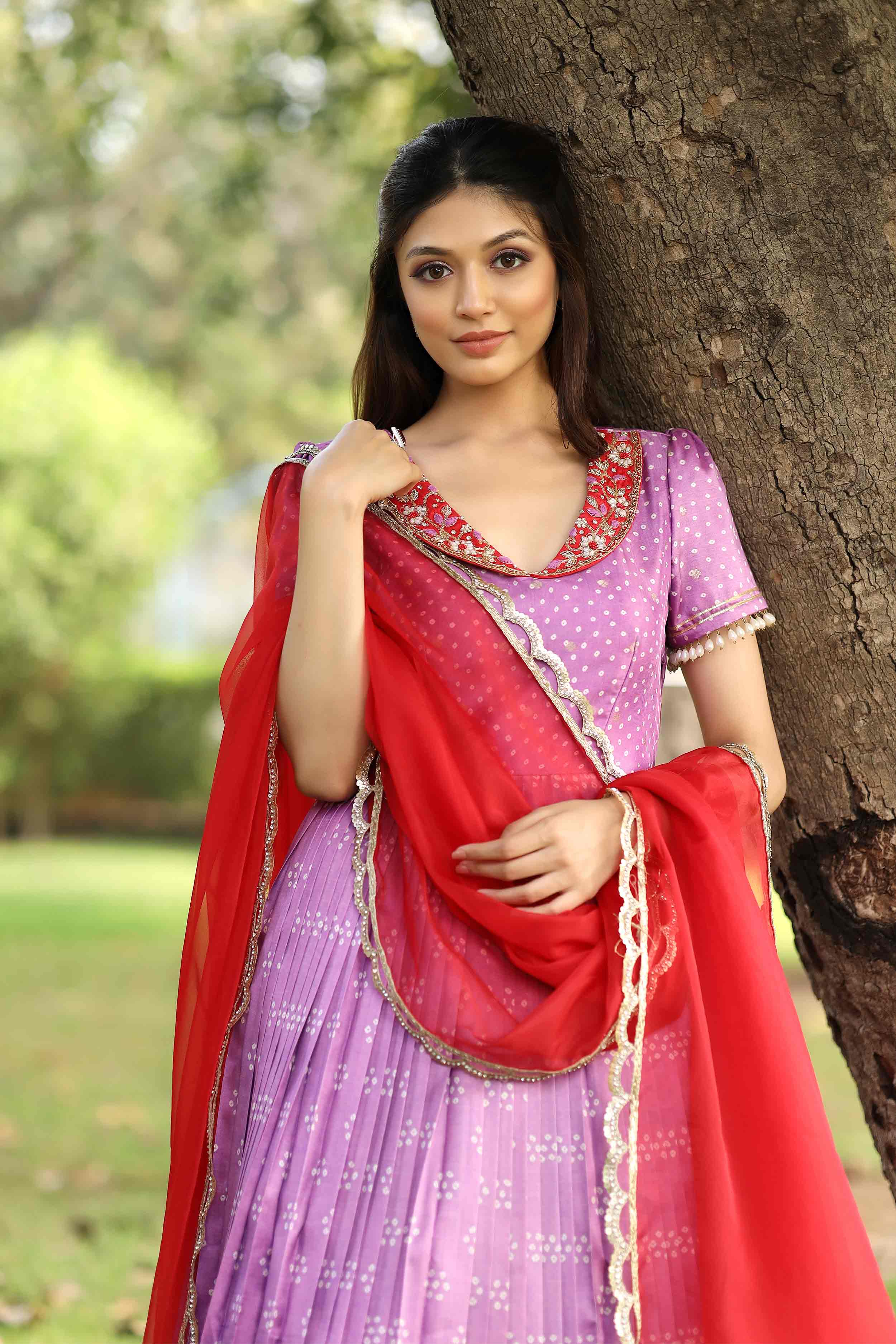 a woman in lavender pattu dress