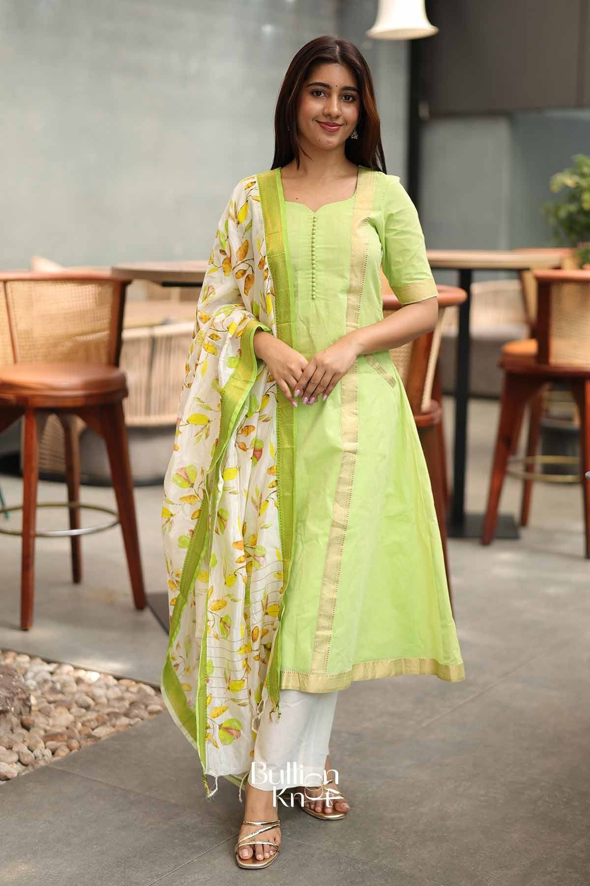 Lime green A-line Manglagauri suit set with matching straight pants, featuring a fitted bodice and 3/4 sleeves, perfect for traditional occasions.