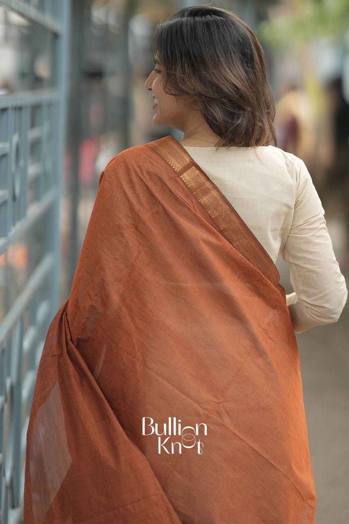 Woman smiling in Mishka Mangalgiri Cotton Maroon Kurta Suit Set with accessories