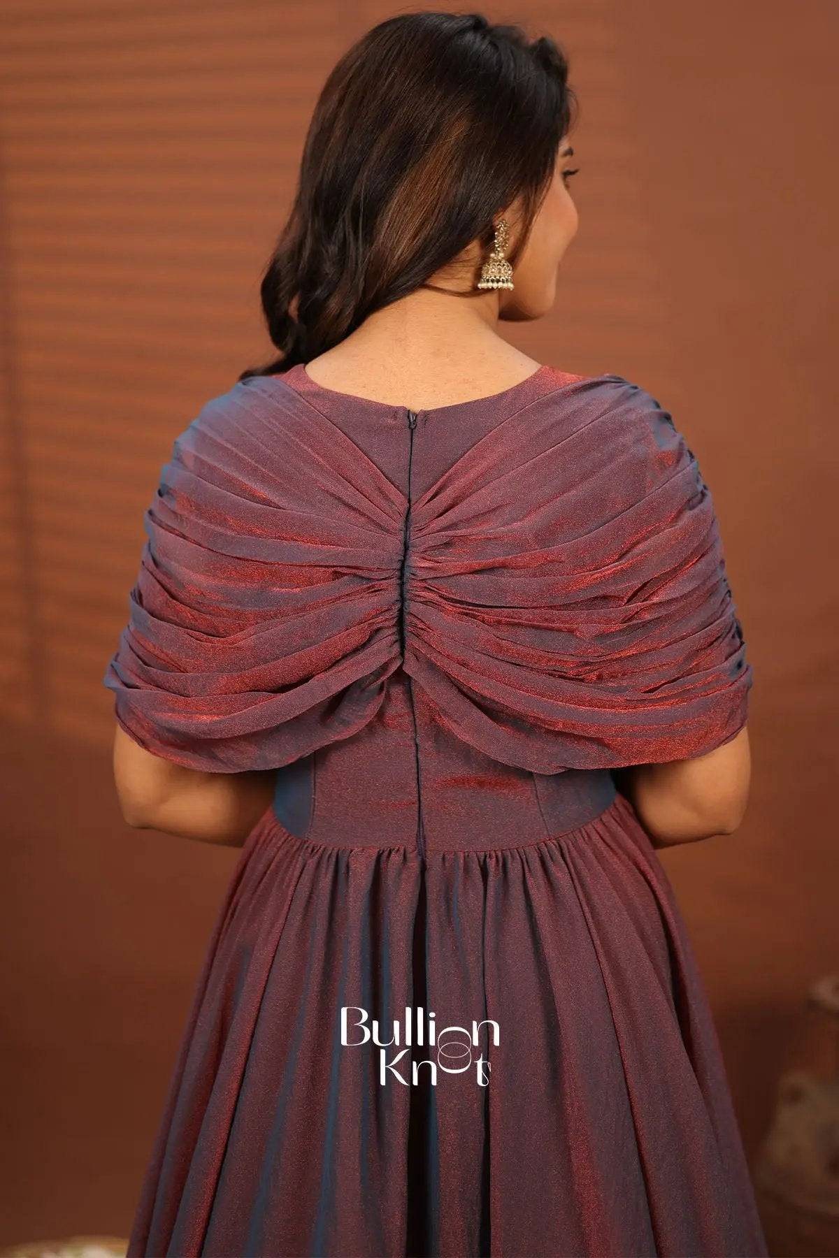 Model wearing Nyasa Wine Indowestern dress with matching earrings for festive events