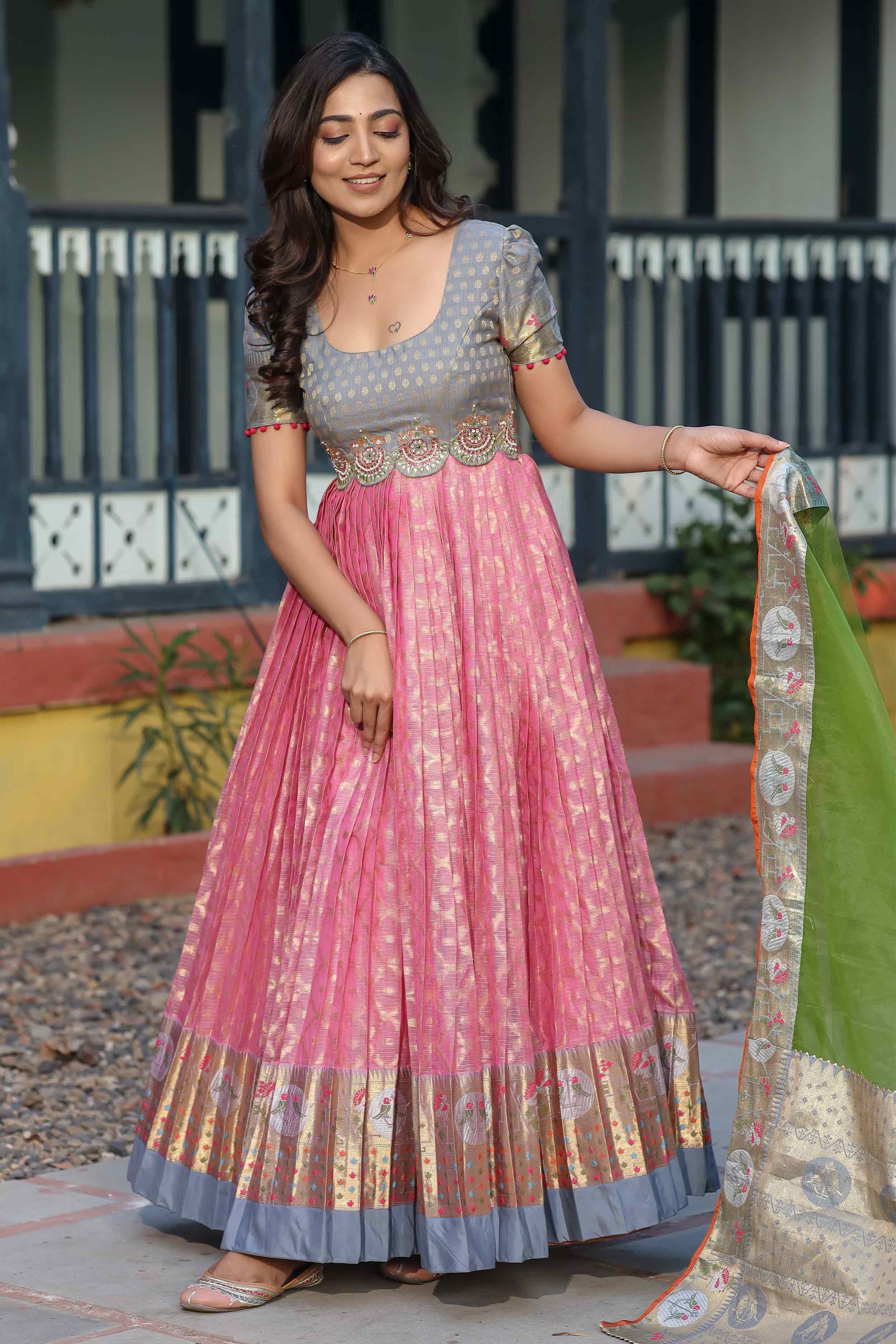 a woman in grey and Pink Pattu Dress