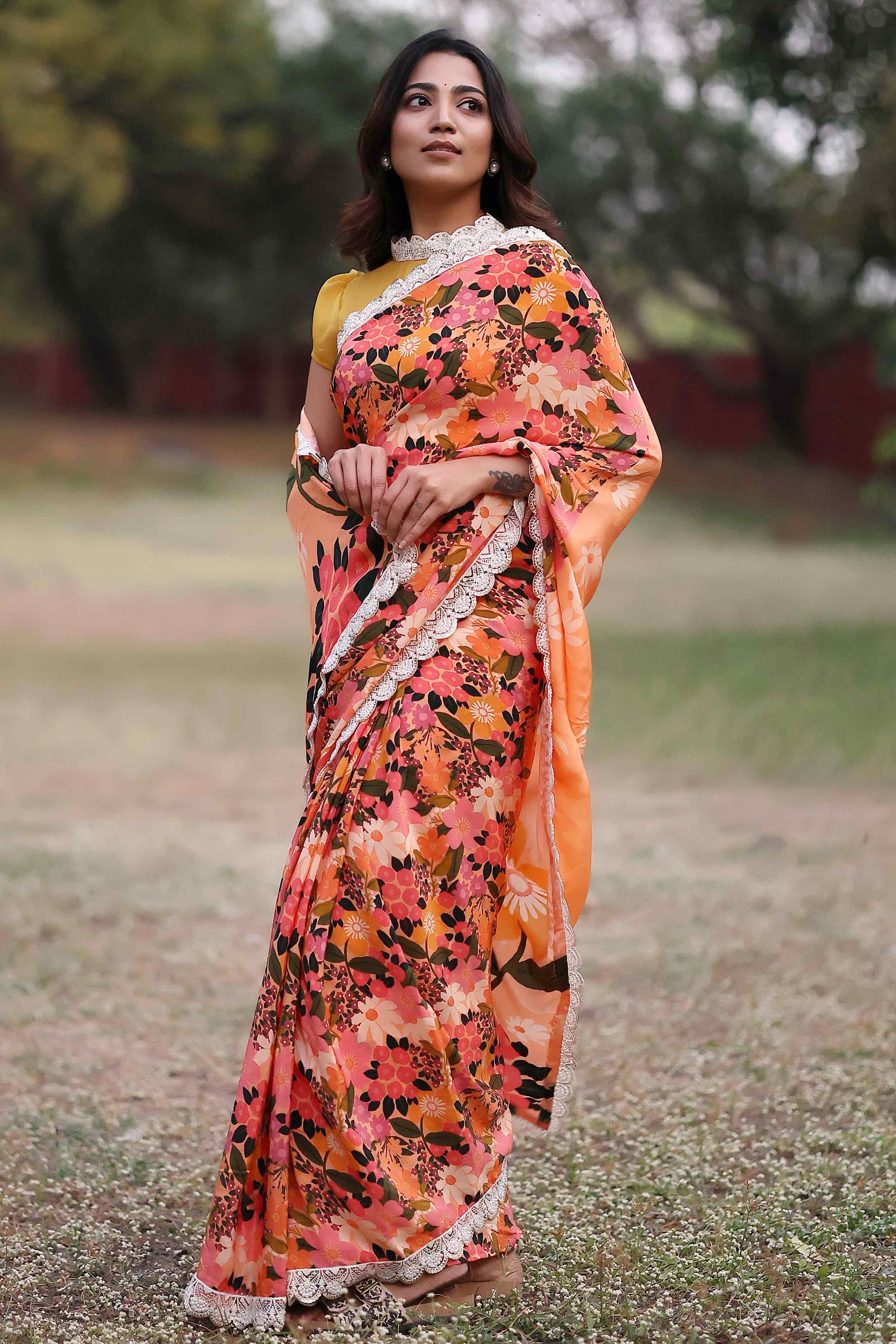 a woman in peach silk saree