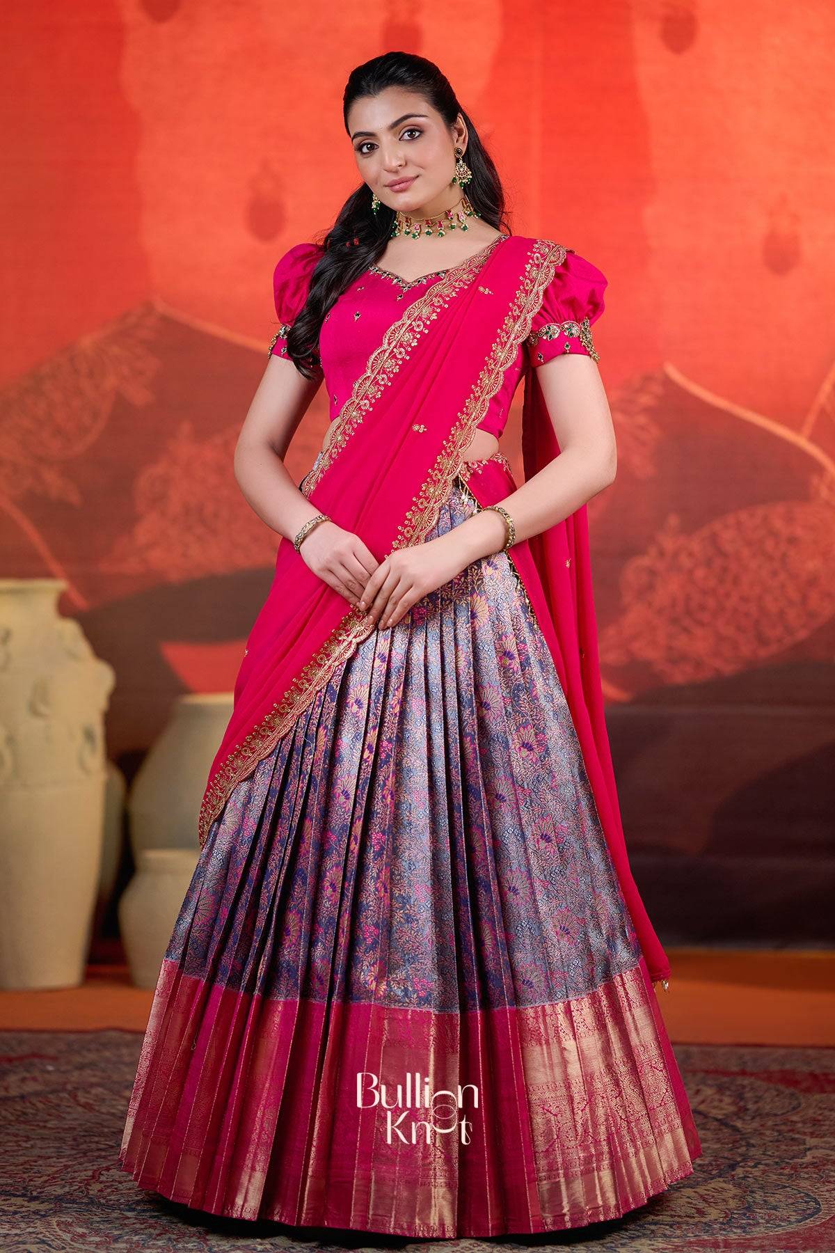 Exclusive Lehenga - Rithvika Banarasi Lehenga Set in Pink at bullionknot featuring a vibrant pink blouse and dupatta with a pleated Banarasi skirt.