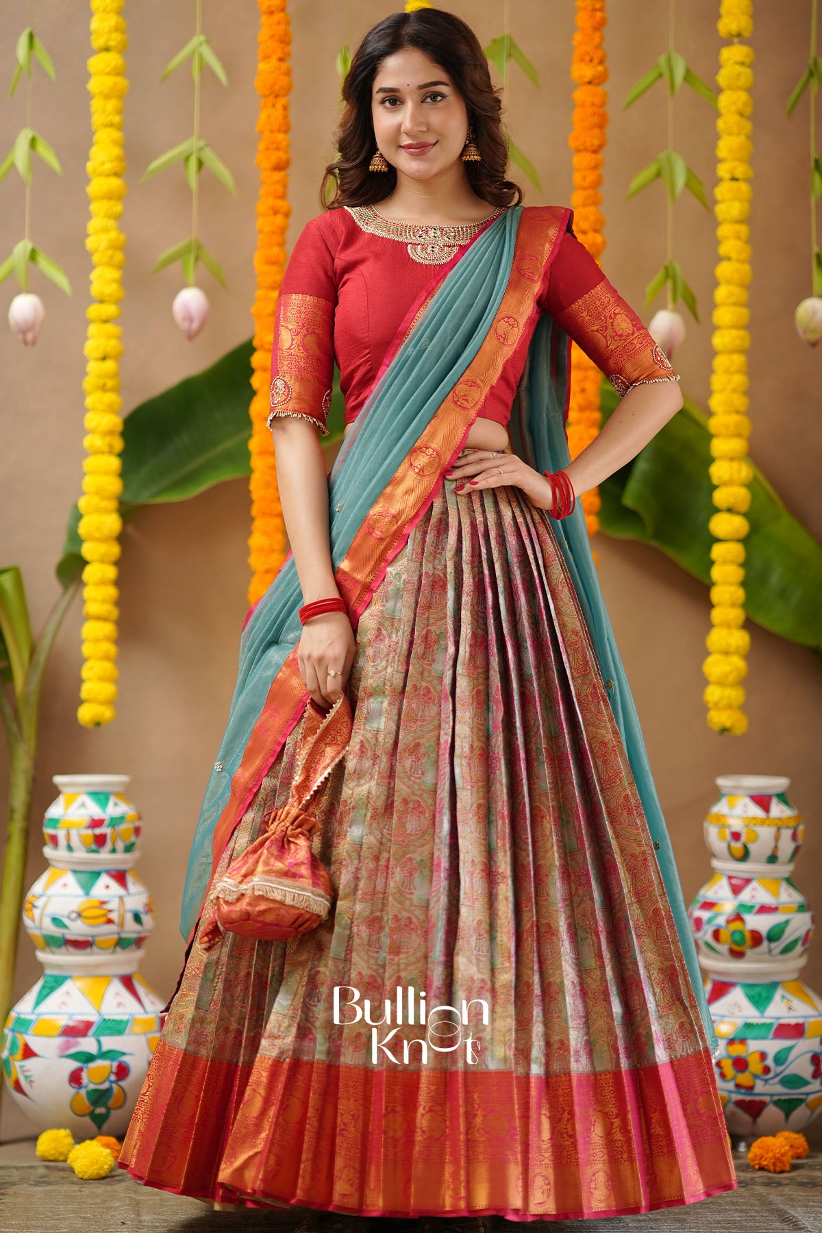 Sanskruti Red Semi-Kanjivaram Silk Lehenga with matching Potli Purse – front view.