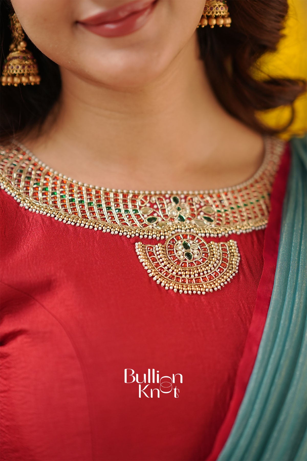 Heavy hand-embroidered blouse design with shimmering zari and stone work.