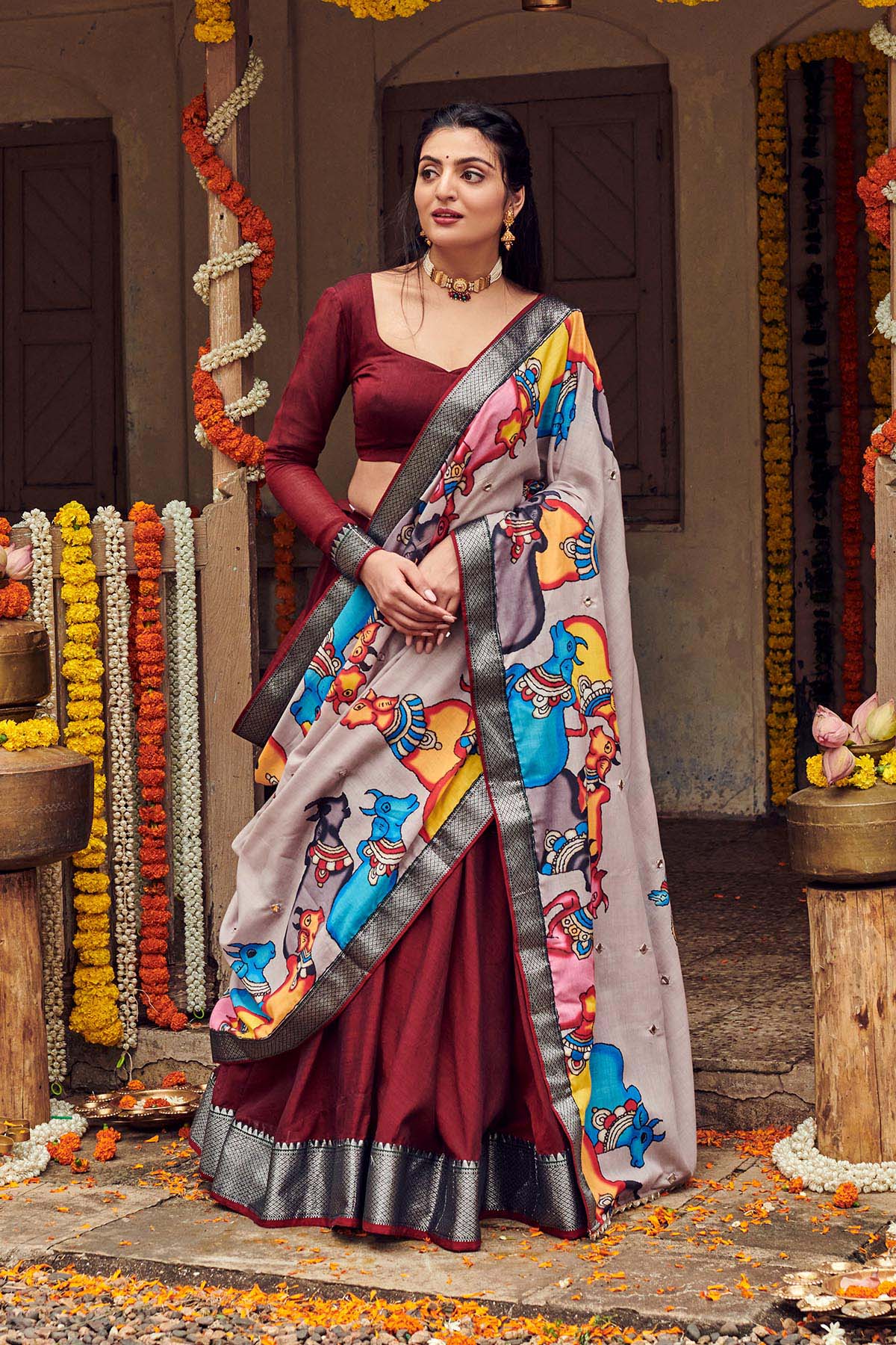 a women in dark maroon handloom lehenga dress with cotton dupatta, dress name Shisha kalamkari Lehenga Set
