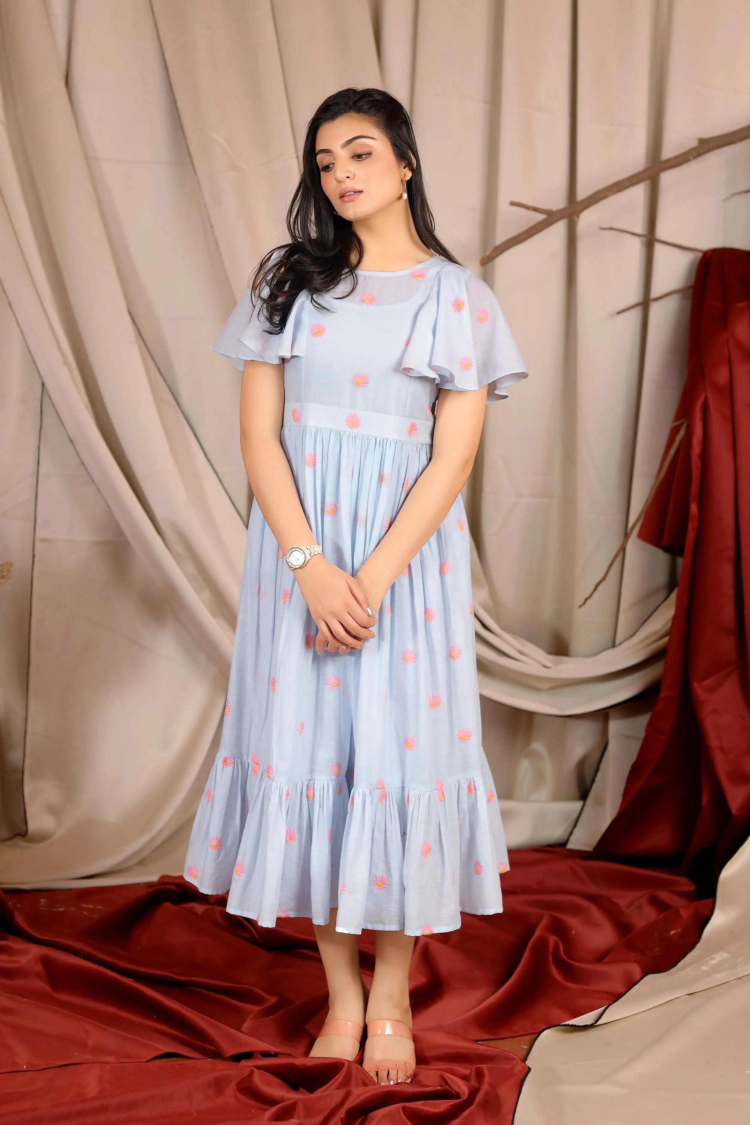 a woman in powder blue long dress