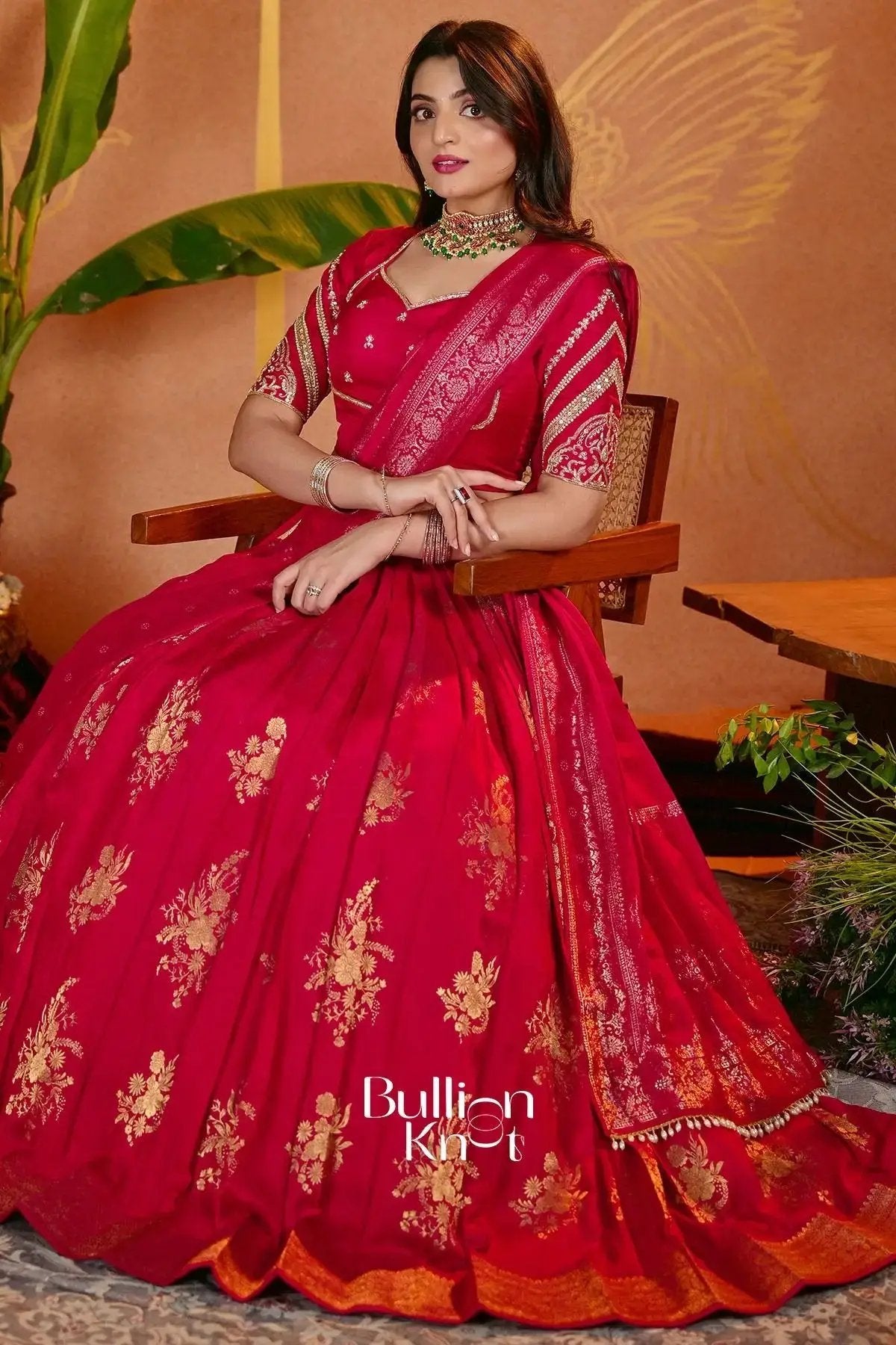 Red traditional lehenga with gold floral embroidery and matching dupatta