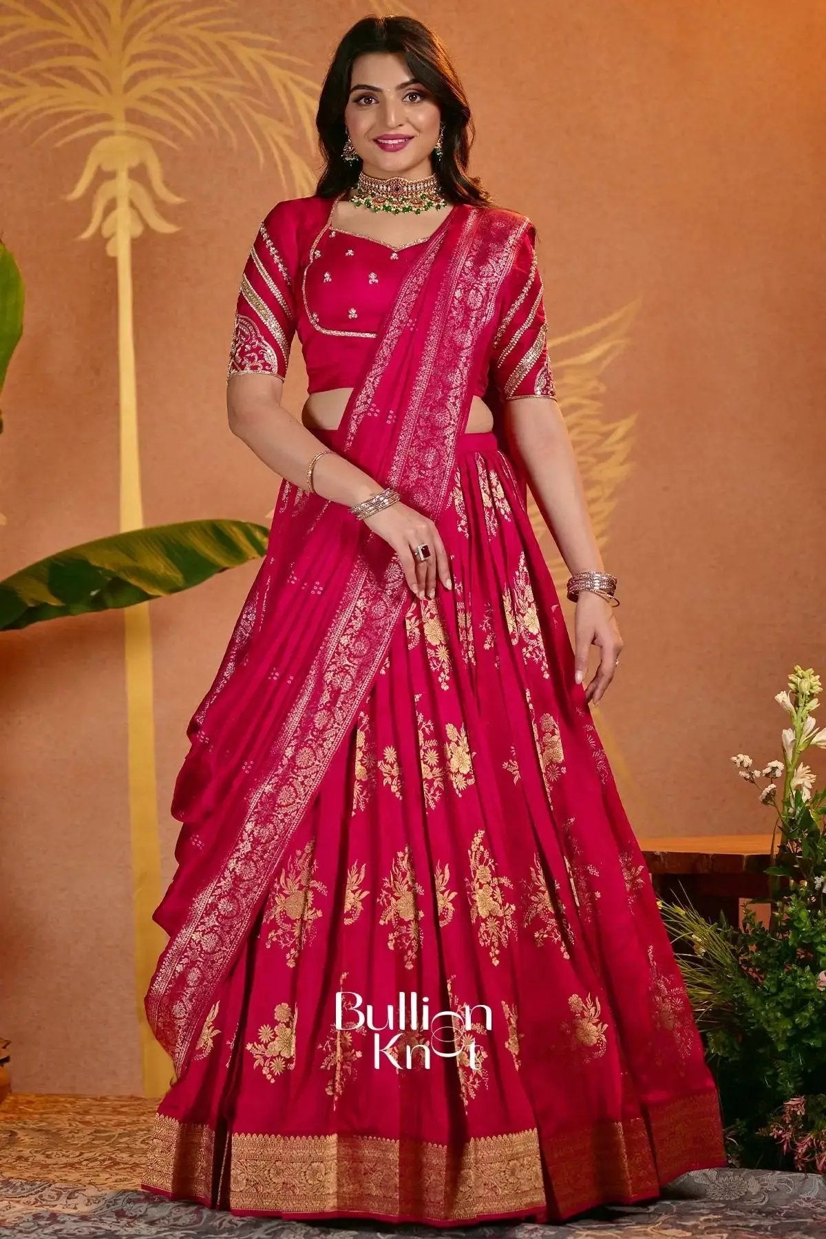 Stylish red lehenga set with detailed embroidery and matching accessories