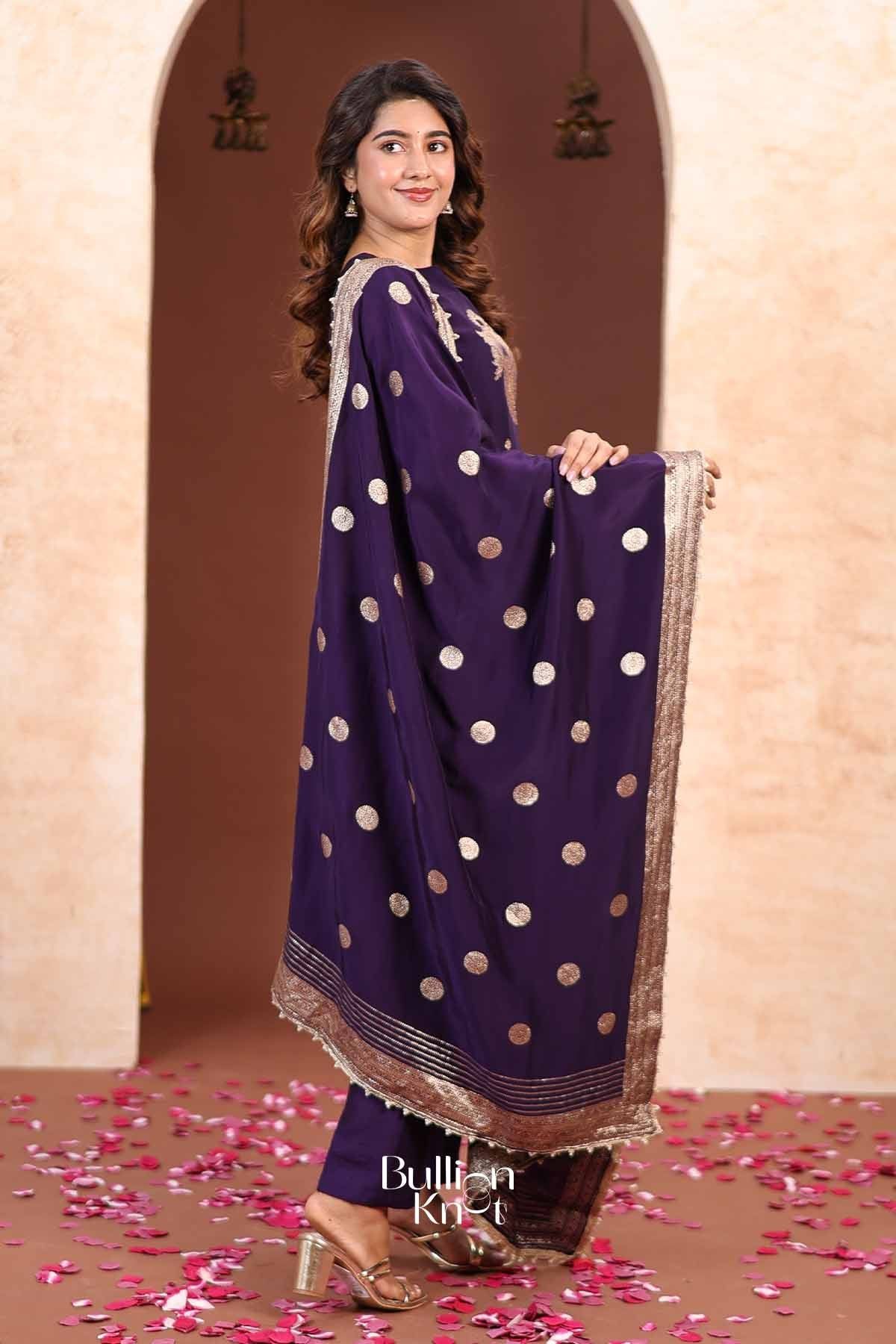 Elegant purple traditional kurta and palazzo set with gold polka dot pattern, embellished neckline, and matching dupatta for festive occasions